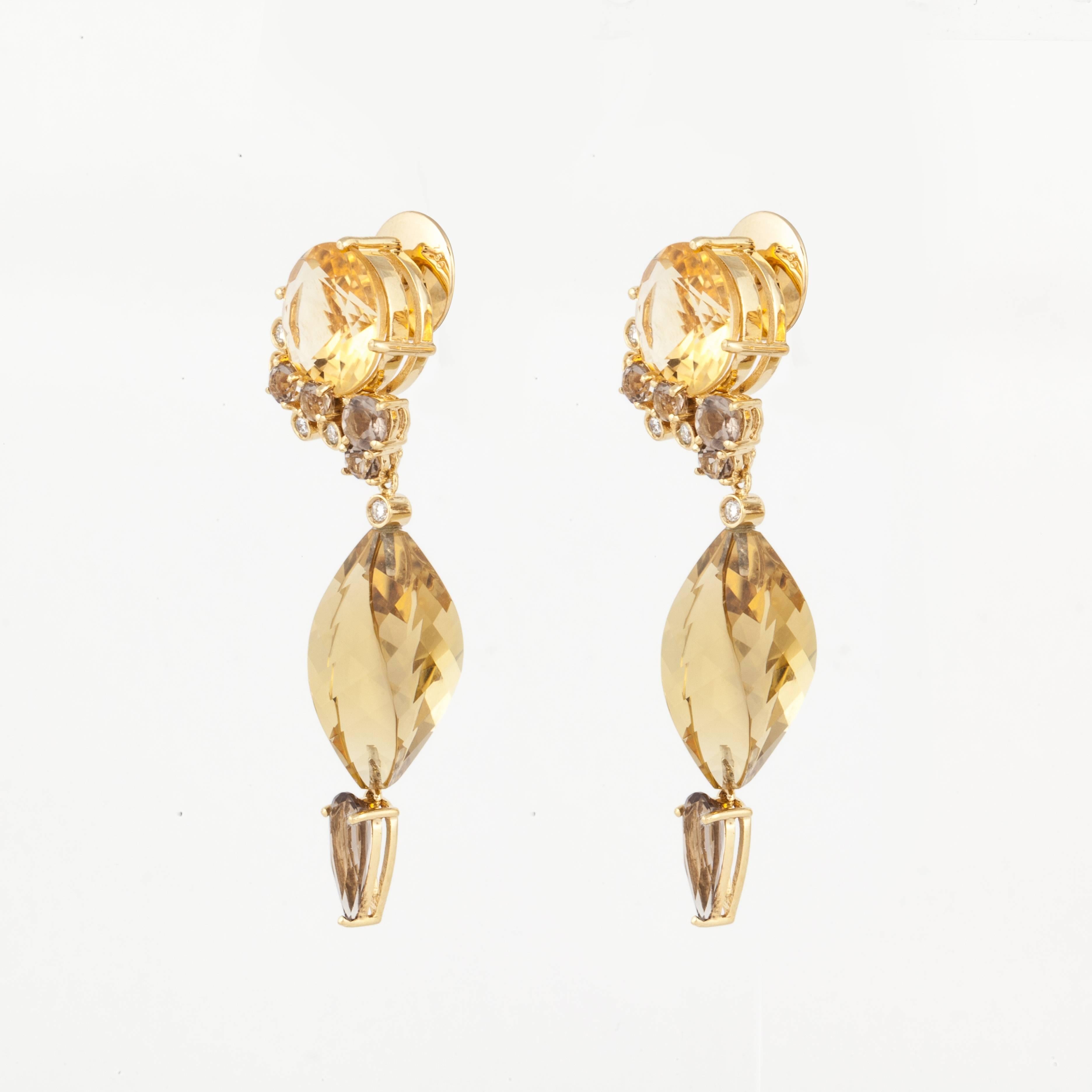 Denoir 18K yellow gold earrings featuring citrines with dangling topaz stones highlighted with diamonds.  There are ten round diamonds with a total weight of 0.30 carats.  The earrings measure 2 1/8 inches in length and 5/8 inches wide.  They have