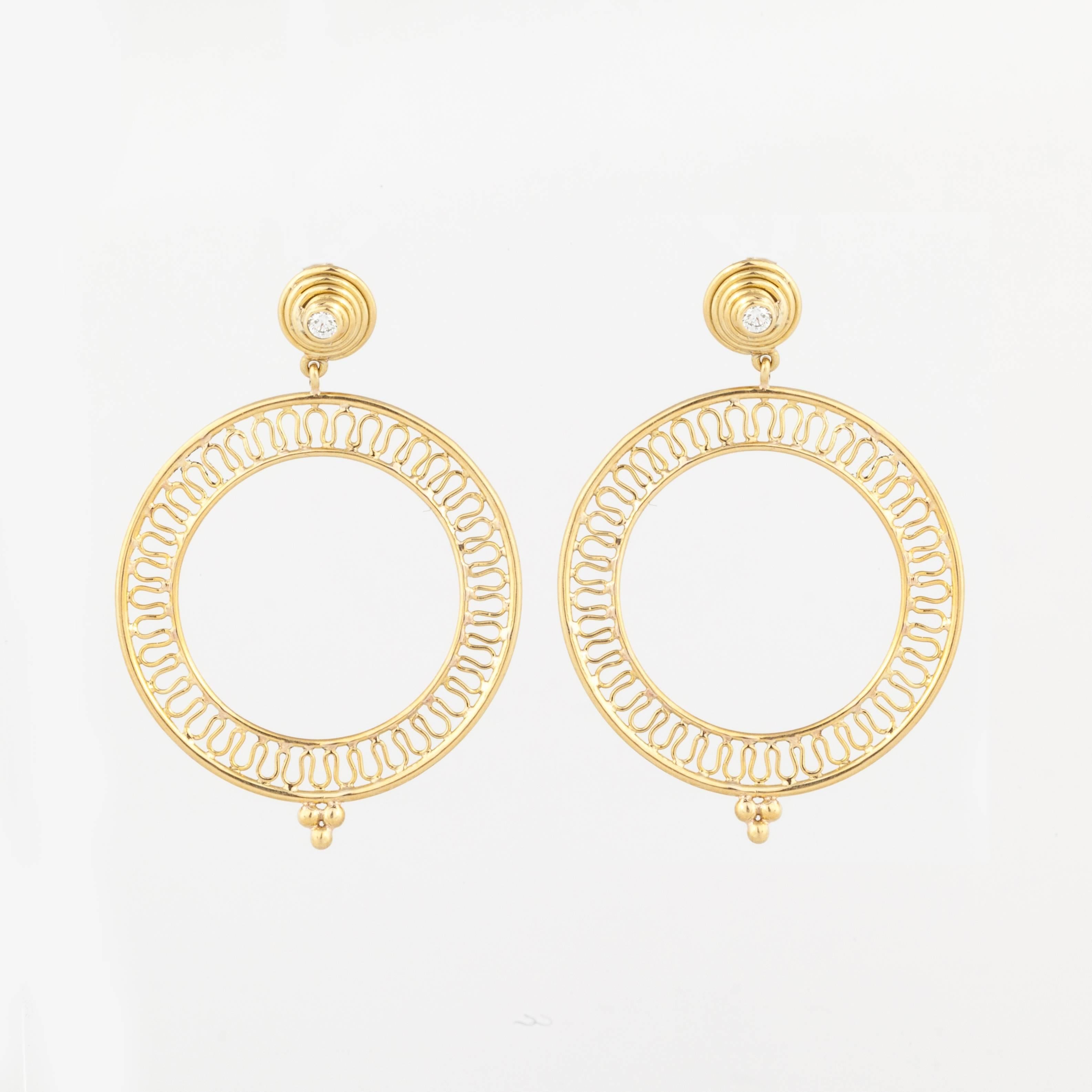 Yellow gold earrings marked 