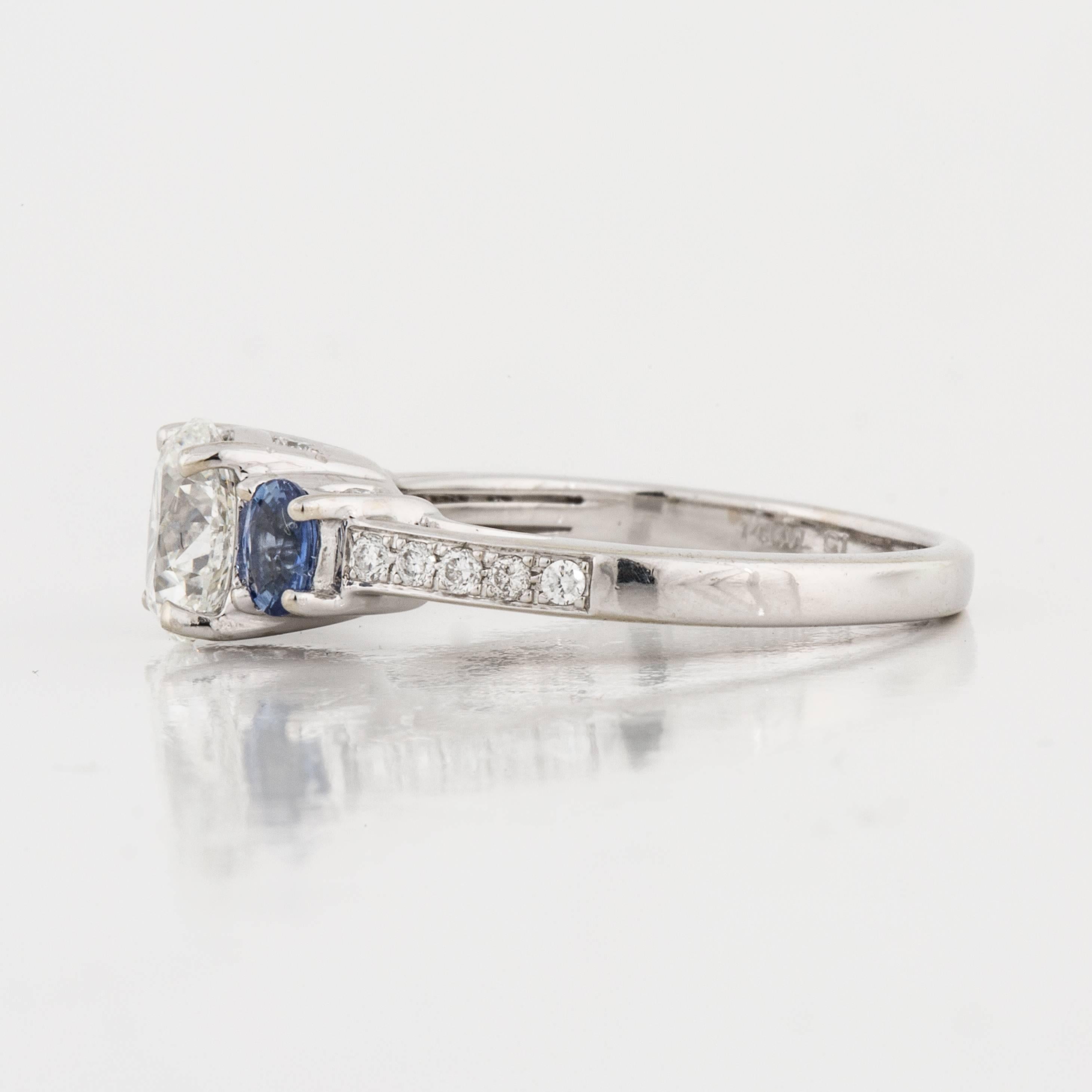 tiffany three stone engagement ring with sapphire side stones in platinum