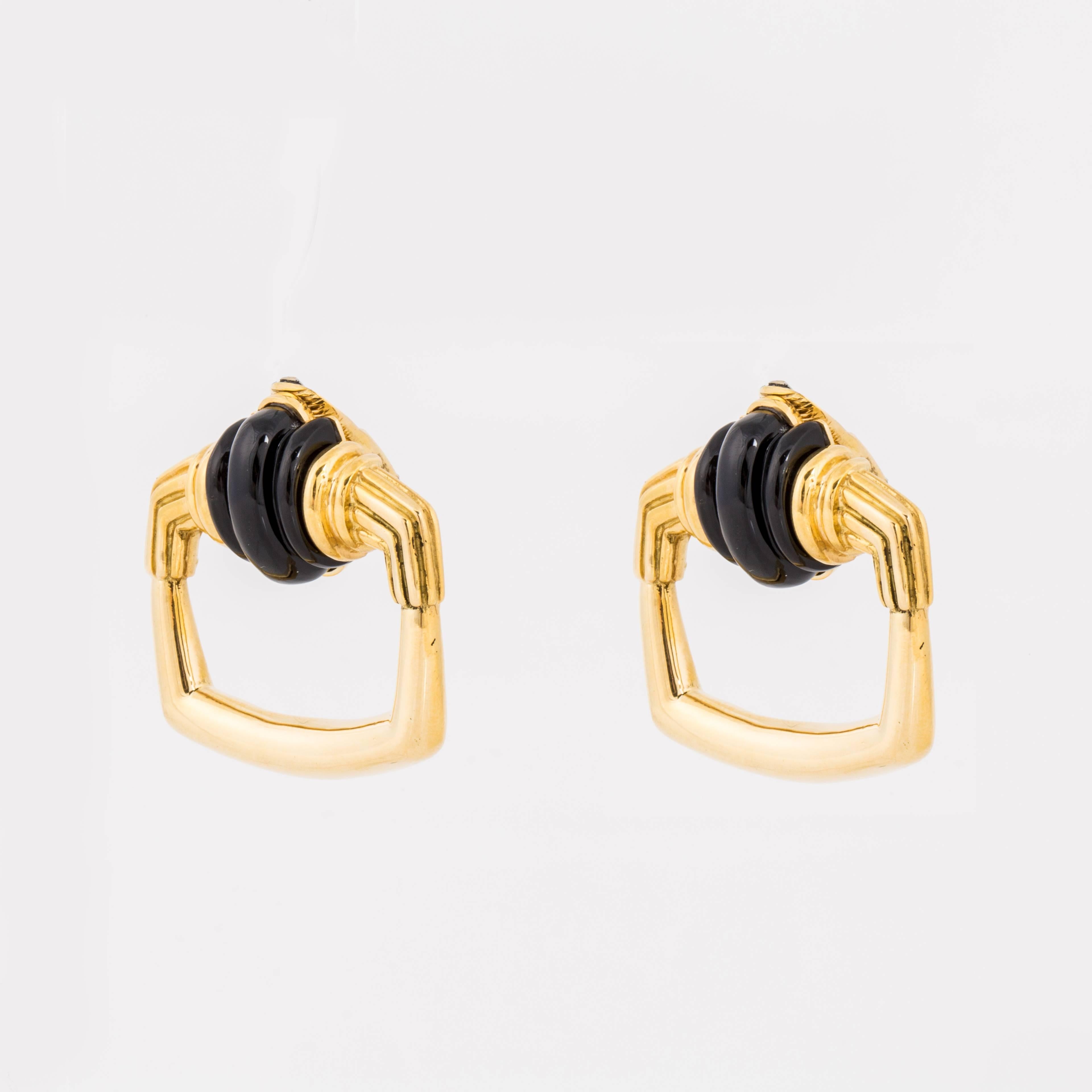Aldo Cipullo doorknocker style earrings in 18K yellow gold and carved onyx.  Marked 