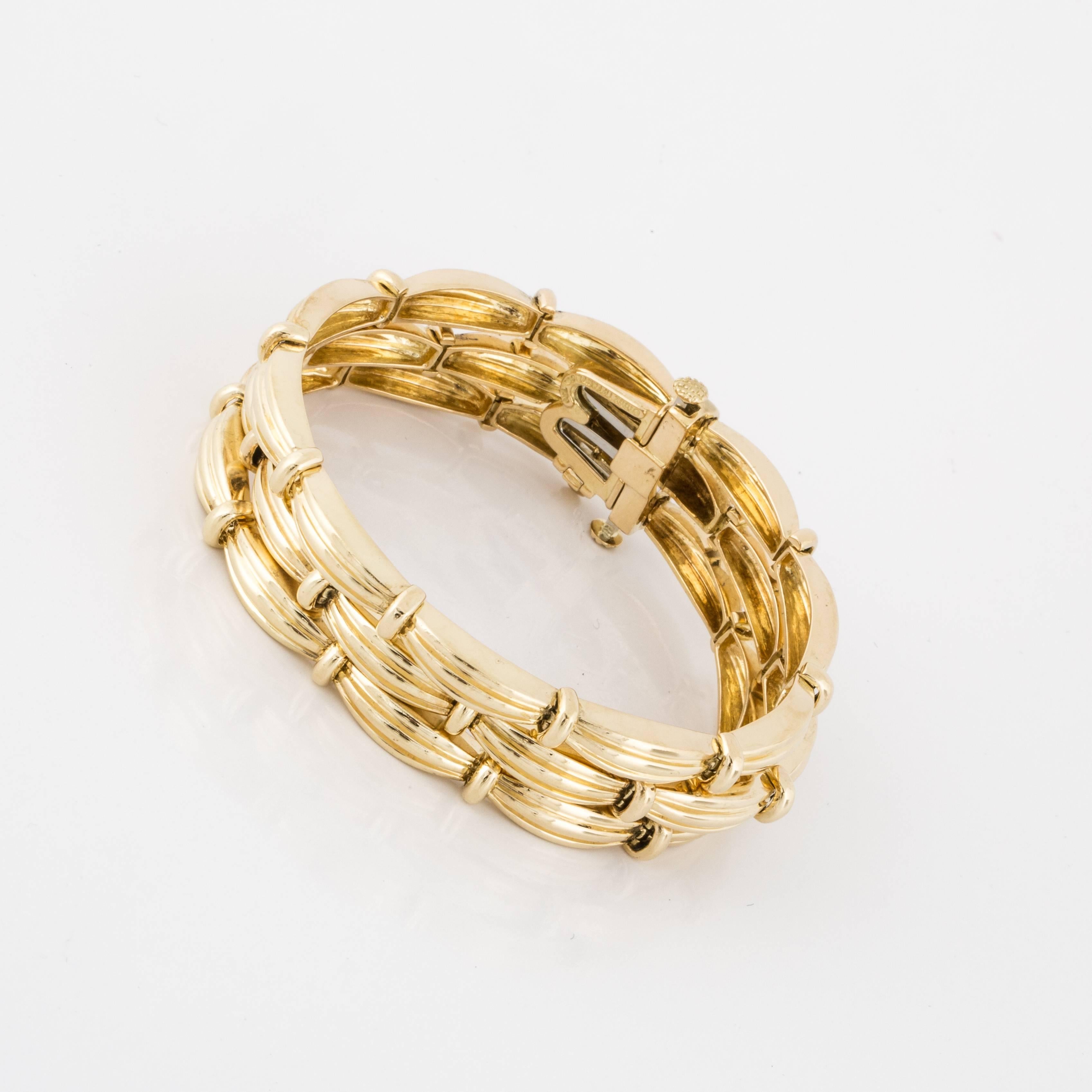 Tiffany & Co. triple strand bracelet in 18K yellow gold.  Marked 