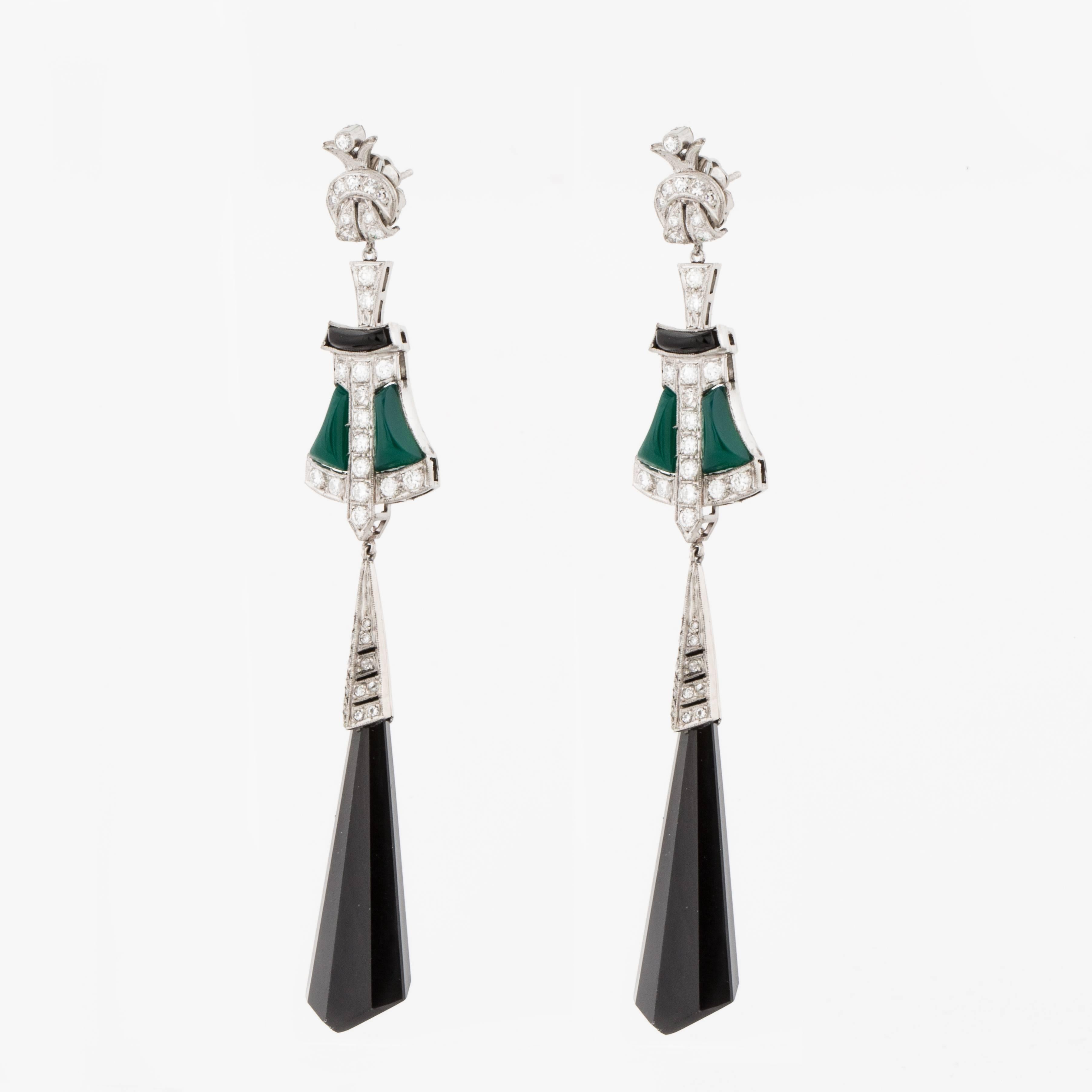 Art Deco style platinum black onyx drop earrings inset with green onyx and accented by round diamonds.  There are forty (40) round brilliant cut diamonds and thirty-eight (38) single cut diamonds that total 2.20 carats, G-H color and VS1-I1 clarity.