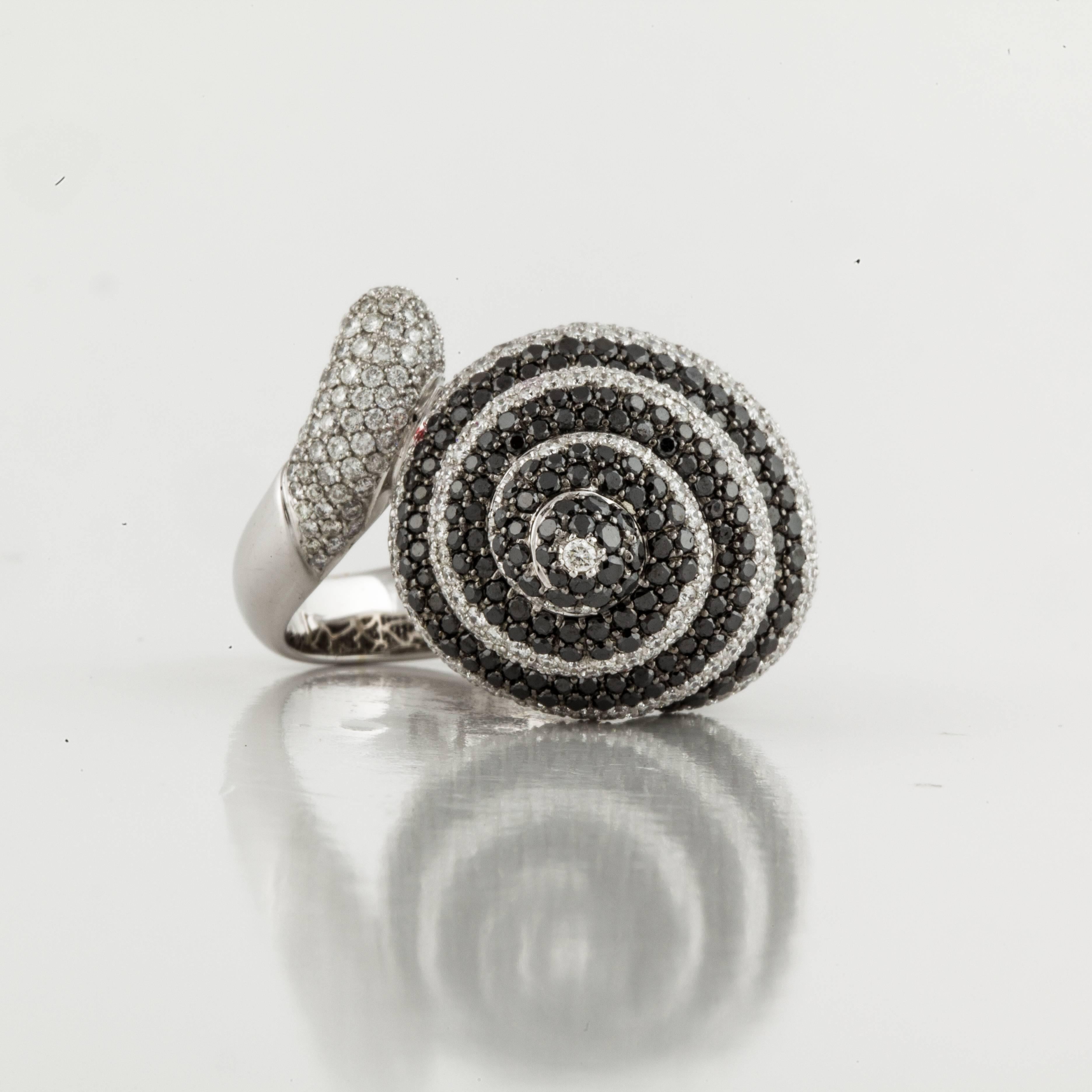 Odelia ring in 18K white gold depicting a shell with black and white diamonds.  The ring is stamped 
