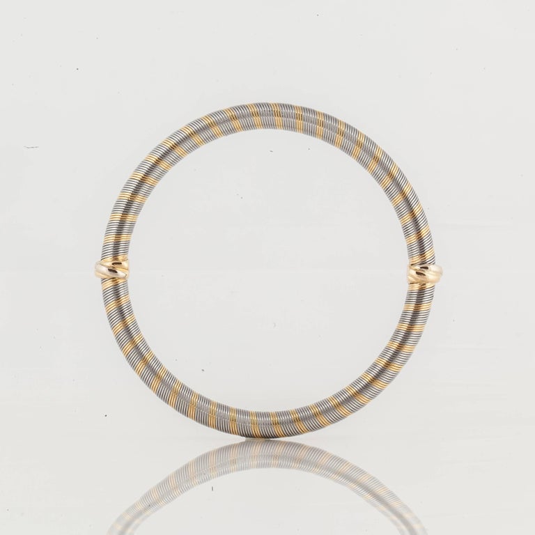 Cartier bangle bracelet in 18K white and yellow gold.  This bracelet is marked 
