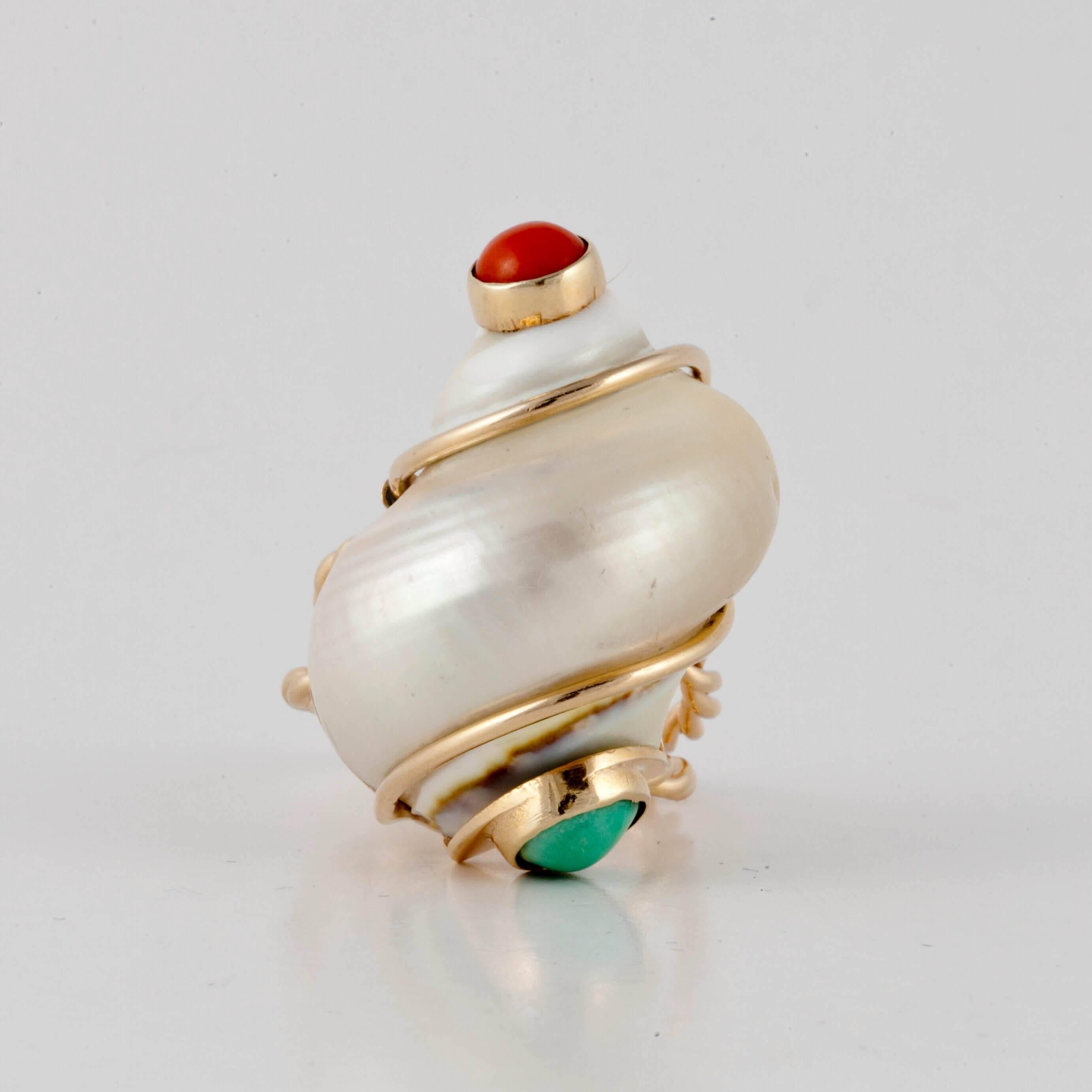 Classic Seaman Schepps ring!  This ring features a large seashell topped on one end with coral and on the other, turquoise.  It is set in 14K yellow gold.  Presentation area is 1-3/8