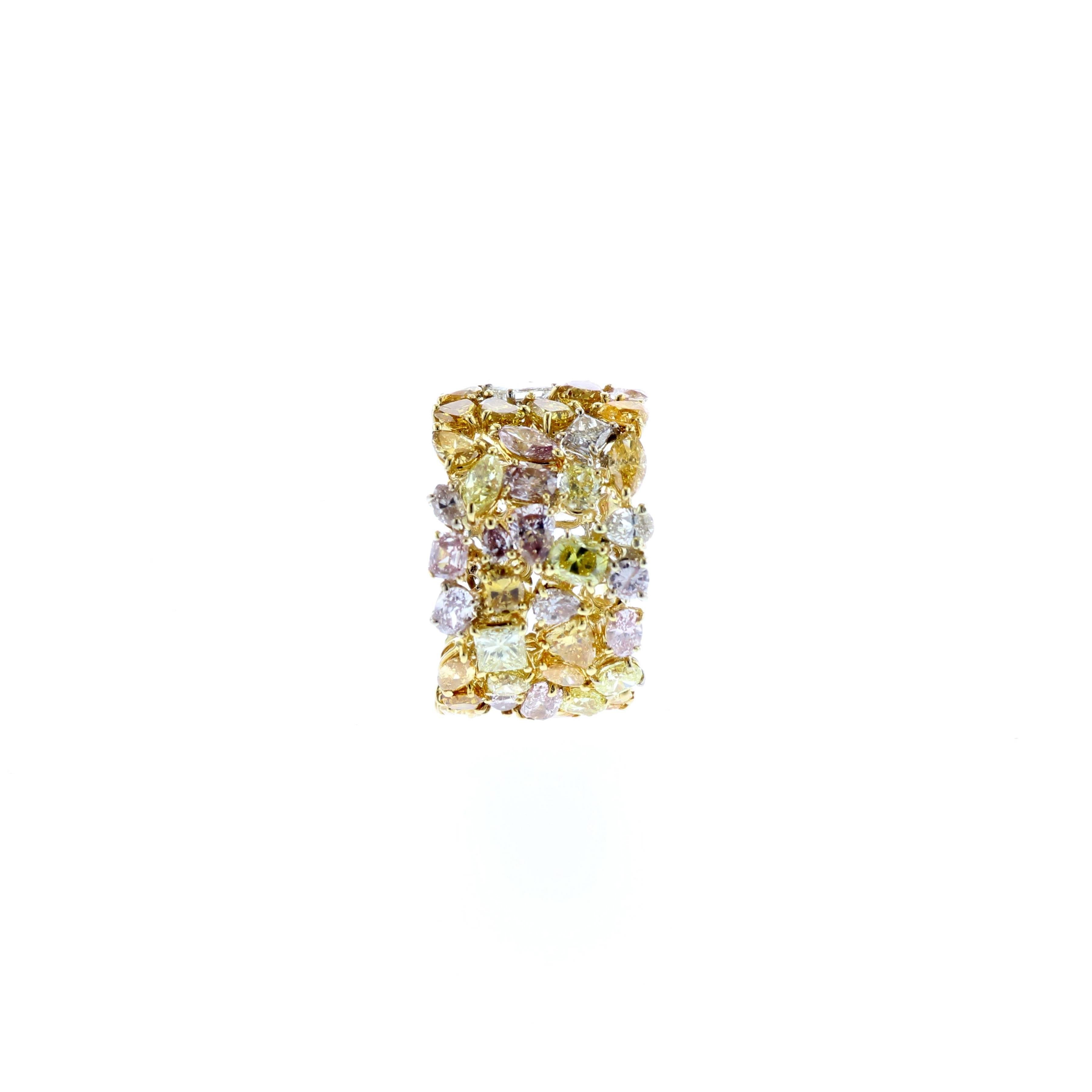 18K yellow gold wide multi-colored diamond band with 42 multi-shaped diamonds that total 8.60 carats.  The diamonds are VS1-SI2 clarity.  The ring is stamped on the inside 