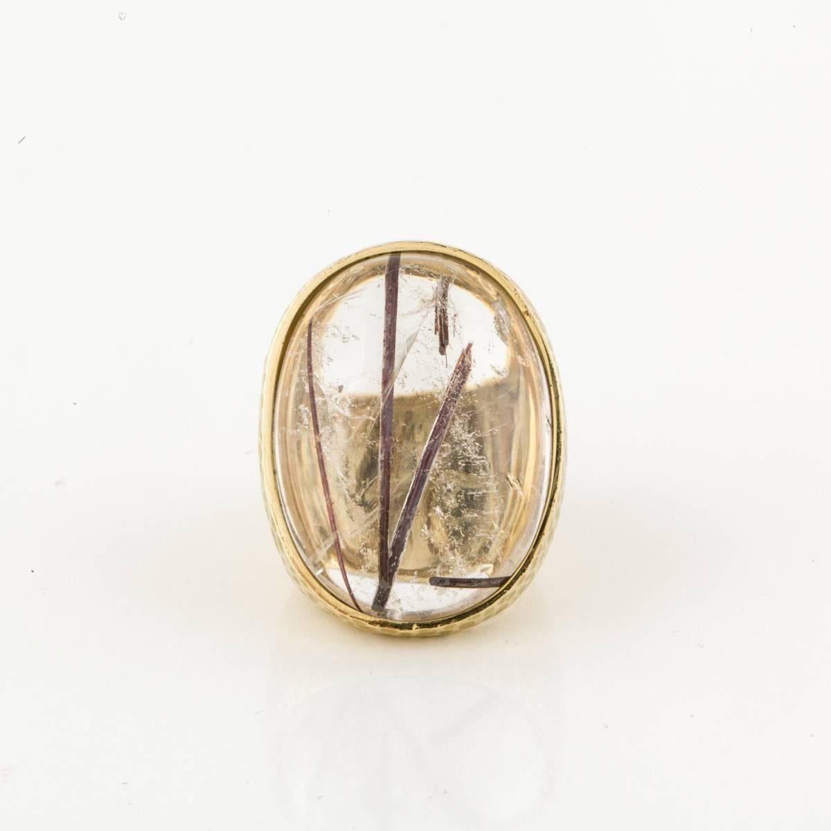 Rutilated quartz ring in 18K hammered yellow gold.  Marked on the inside 
