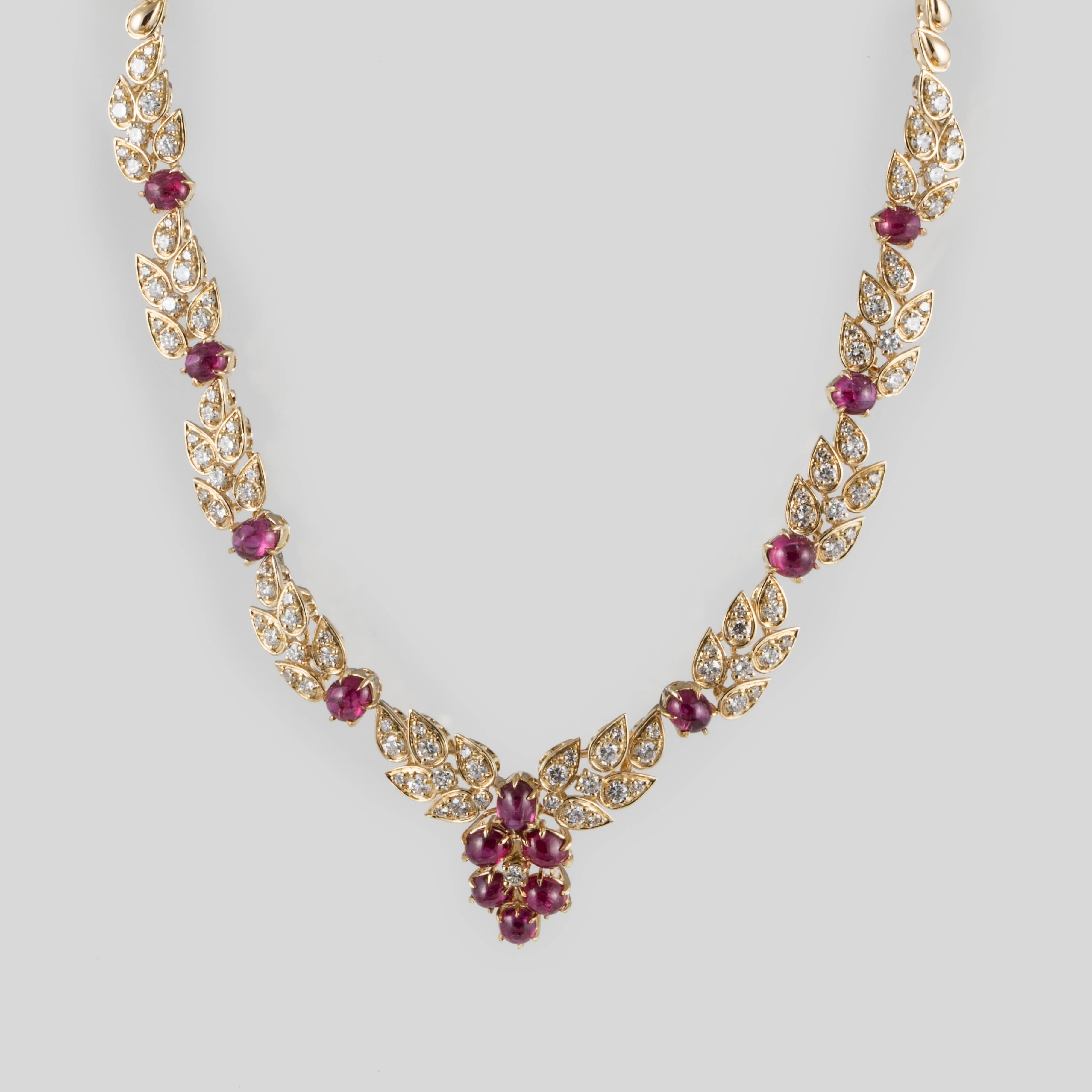 Adler necklace in 18K yellow gold featuring cabochon rubies accented by diamonds.  Marked 
