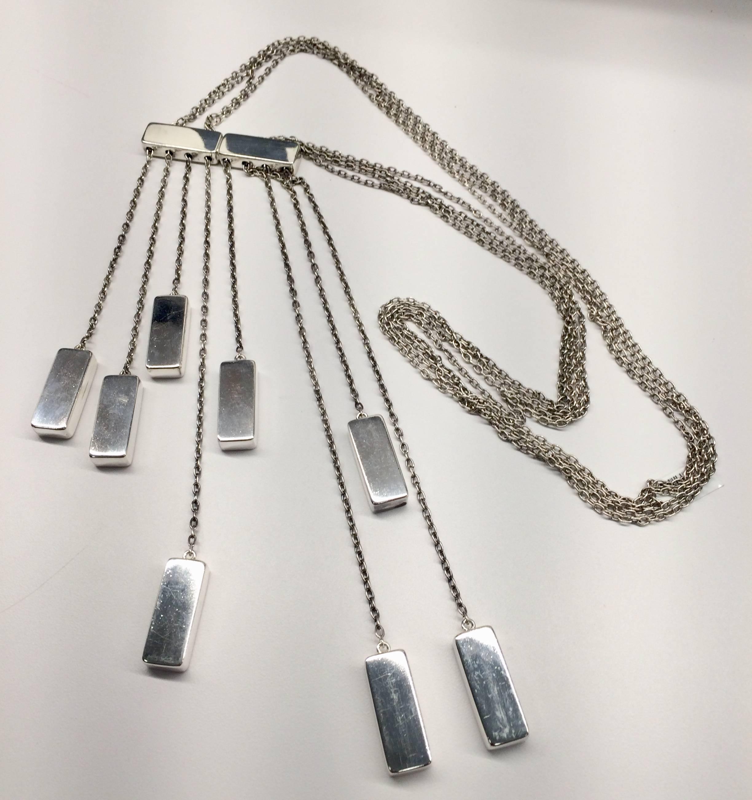 Necklace designed by Astrid Fog for Georg Jensen.  It has long multiple chains with silver bars dangling from a larger silver bar.  Overall length is 26 inches.  The center bar measures 2 1/2 inches by 1/2 inch.  On the back of one of the dangling