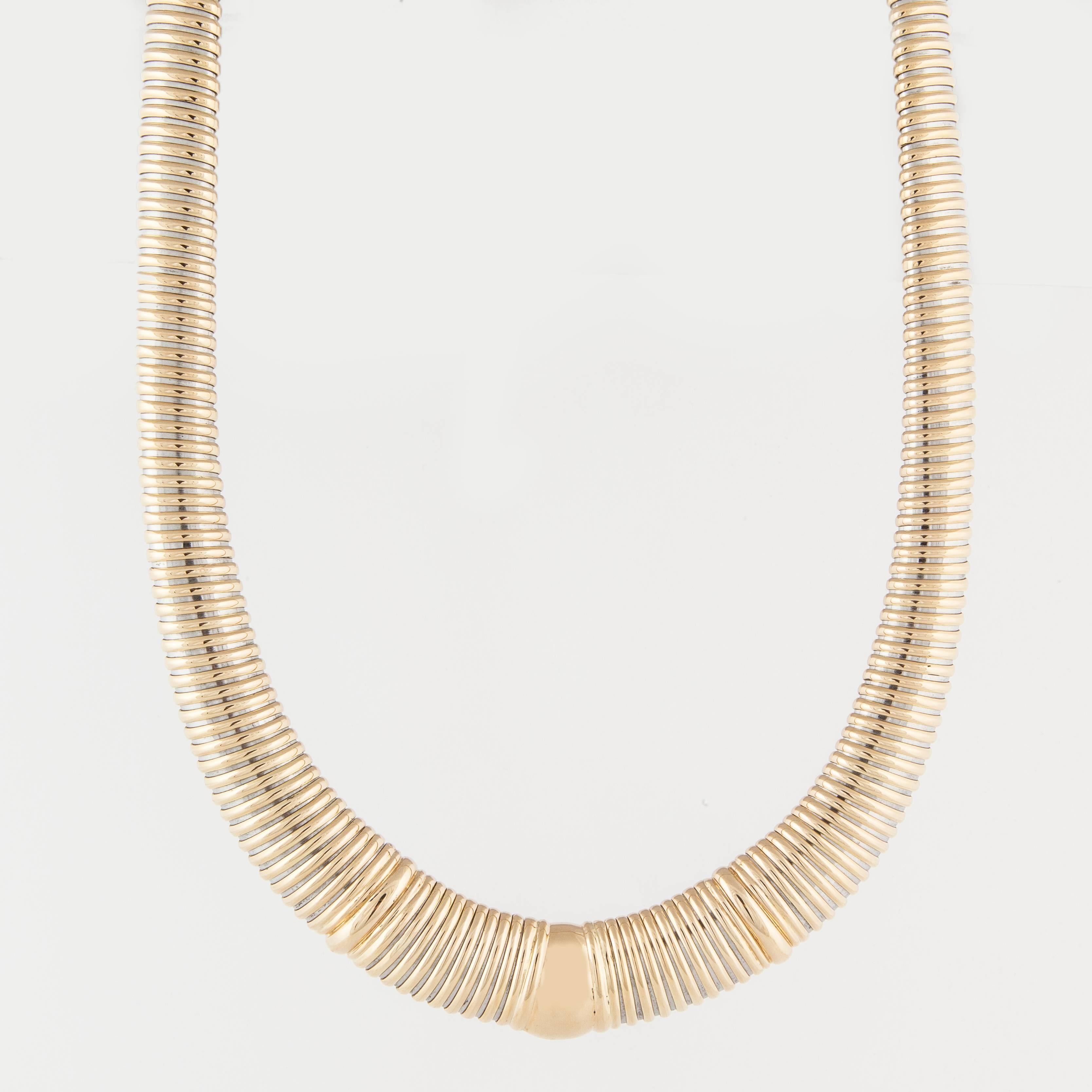 Vintage Cartier tubogas style necklace in 18K yellow gold and stainless steel.  Marked 