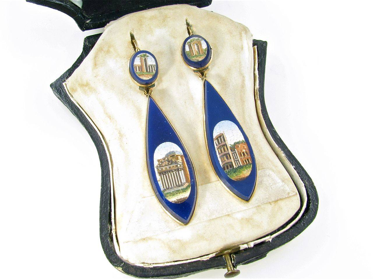 A pair of antique micromosaic and lapis lazuli, and 18 karat yellow gold earrings, Vatican school, 19th Century.  The earrings are designed as oval micromosaic tops depicting the Arch of Constantine and the Imperial Forum, suspending teardrop shaped