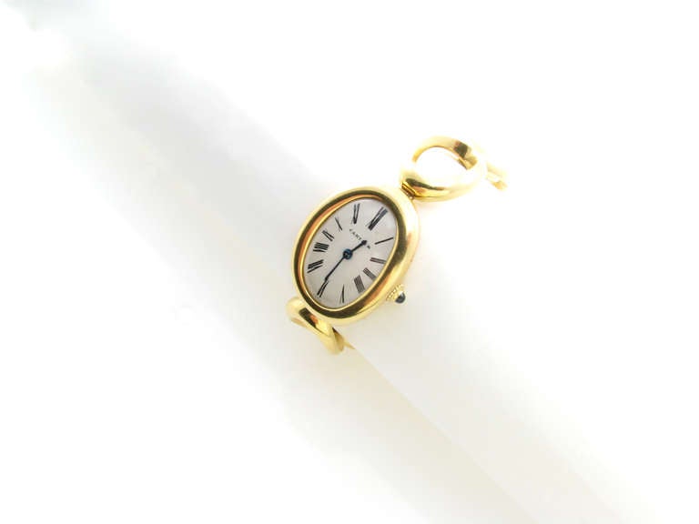 A Cartier Paris 18 karat yellow gold ladies bracelet watch.  Circa 1967.  Signed on the dial with Cartier Swiss, the top of the case is numbered 709, the outside of case is marked 023207 and 50709, the movement is signed Cartier Swiss Fab Swiss