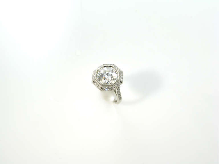 An Edwardian platinum and diamond ring centering an old European cut diamond weighing 4.28 carats with later shank.  The ring is circa 1915, the shank of later date.  The old European brilliant cut diamond is set within the original octagonal