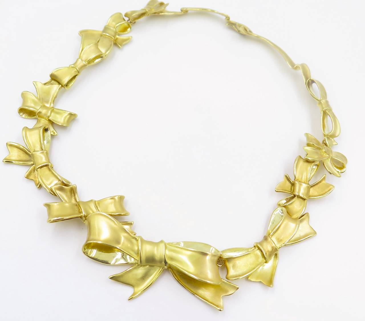 ANGELA CUMMINGS Yellow Gold "Bow" Necklace.