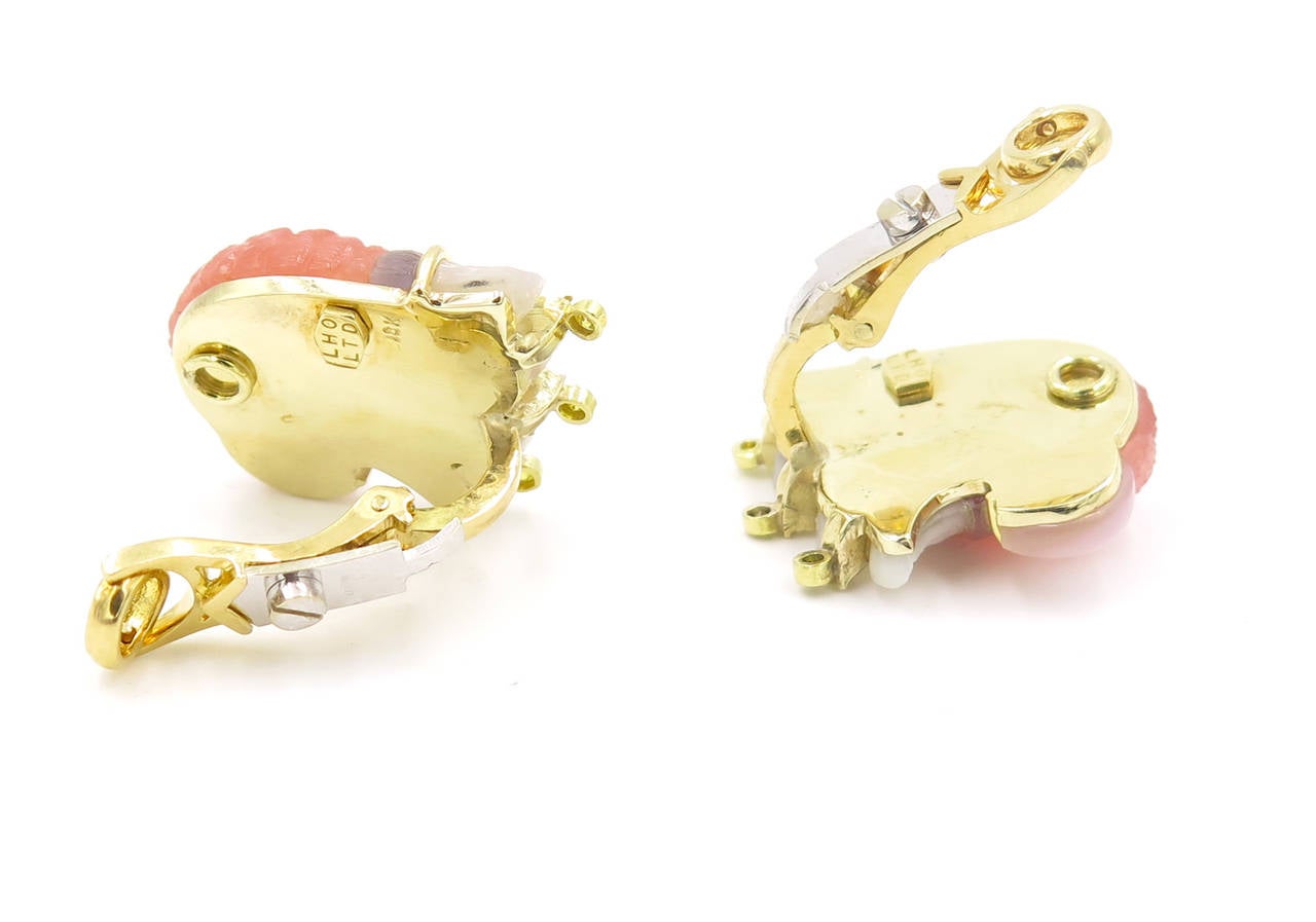 A pair of 18 karat yellow gold, carved tourmaline, carved mother of pearl, diamond and yellow diamond earrings in the form of a bird’s profile.  Signed LHO for Lillian Ostergard.  The earrings have a gross weight of approximately 22.7 grams and