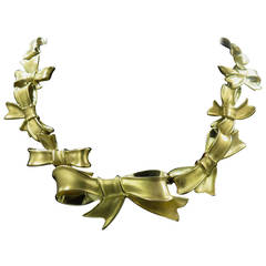 ANGELA CUMMINGS Yellow Gold "Bow" Necklace.