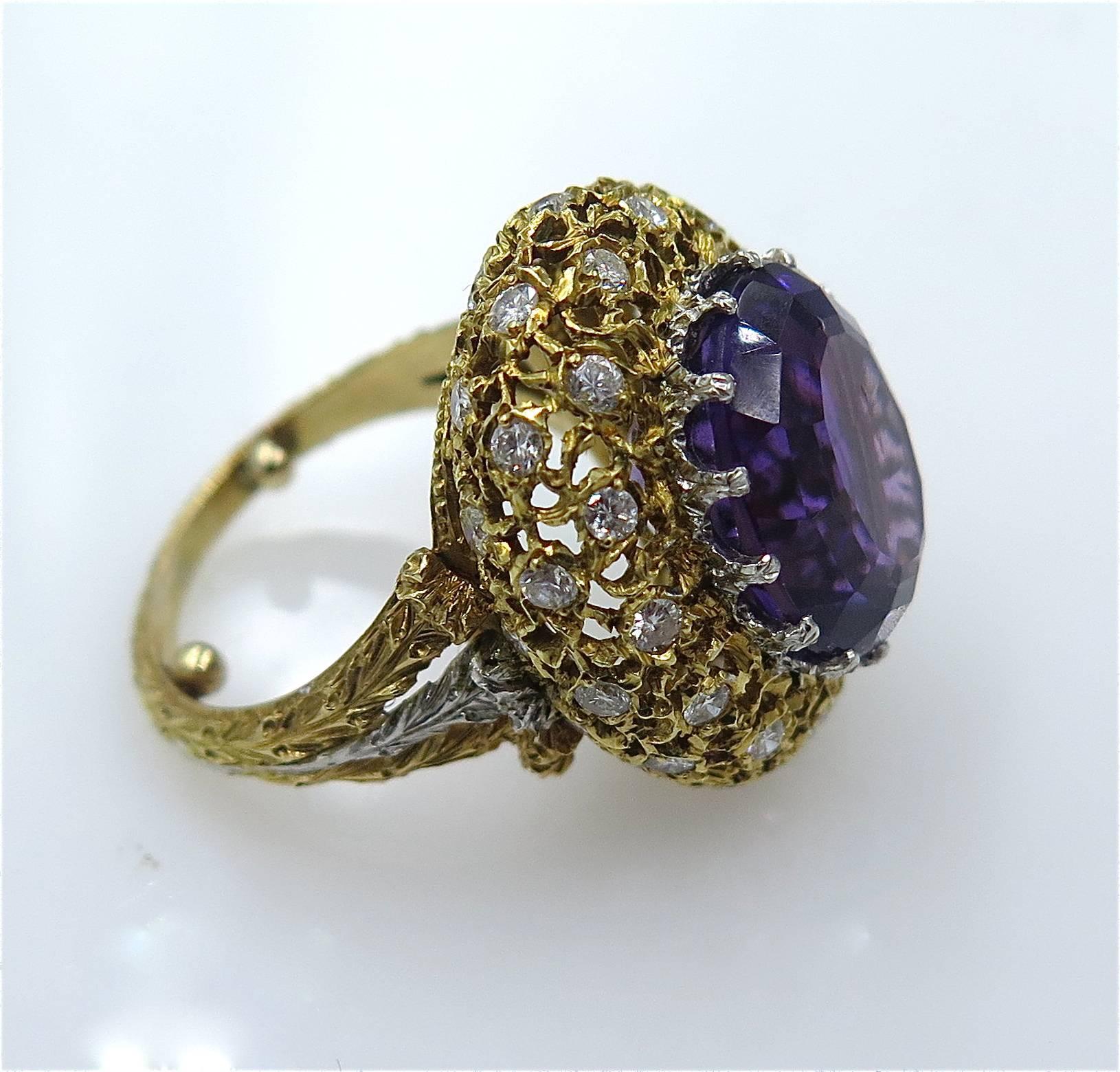 An 18 karat gold, amethyst and diamond ring, Buccellati, Italian. Centering an oval-cut amethyst, measuring approximately 14.00 x 16.90 x 9.00mm, and weighing approximately 7.65 carats, within a textured gold openwork bombe surround, enhanced by