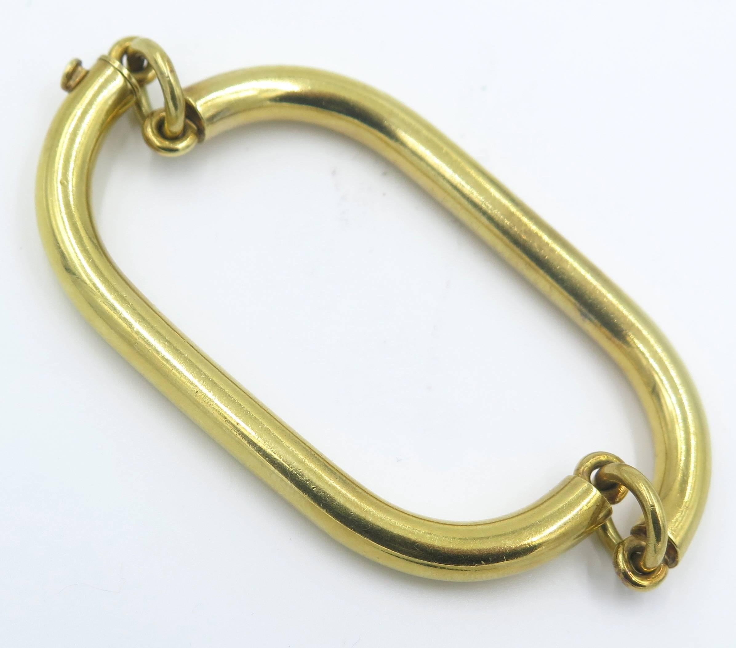An 18 karat yellow gold bracelet, Puig Doria, Spanish. Circa 1970. Designed as polished gold squared links, joined by circular links. Inside diameter measures 7 inches, Gross weight is approximately 32.9 grams. Signed Puig Doria, Spain.
 