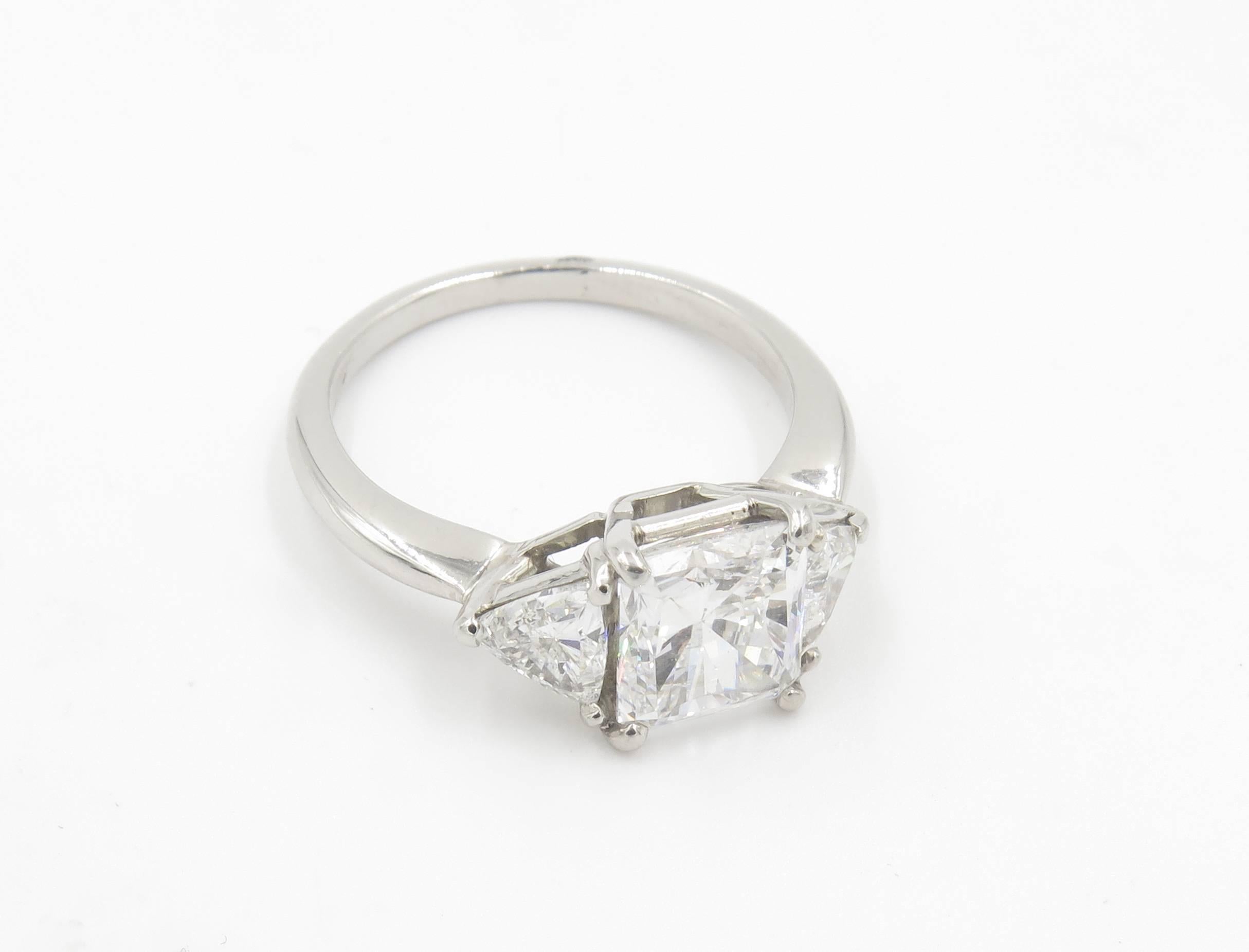 A platinum and diamond ring.  The ring centers a radiant cut diamond weighing 2.04 carats 
GIA Diamond Grading Report 5172281906, dated August 18, 2015, states Shape and Cutting Style Cut-Cornered Rectangular Modified Brilliant, Measurements 7.50 x