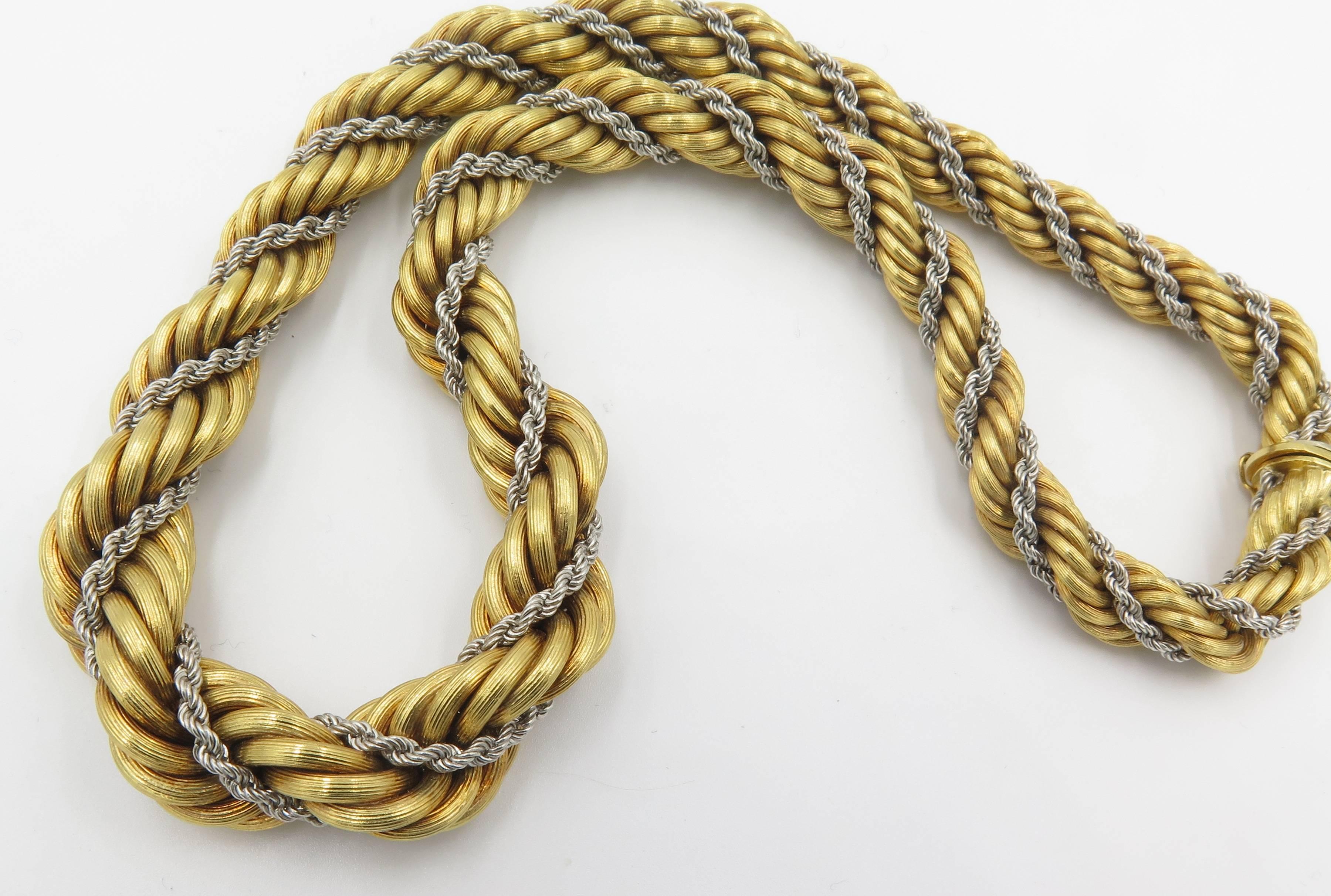 An 18 karat yellow and white gold rope necklace, Italian. Circa 1960. Designed as a graduated yellow gold rope, enhanced by white gold rope detail. Length is 17 1/2 inches. Gross weight is approximately 89.0 grams. Signed Italy, 18K.