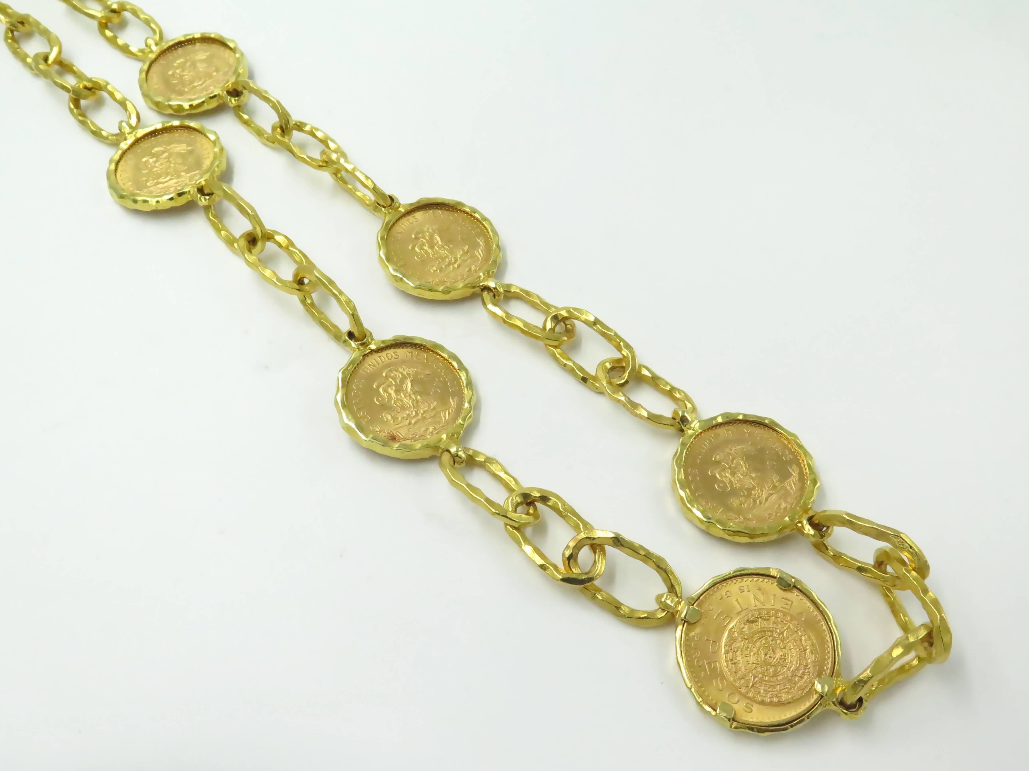 A Jean Mahie 22 karat yellow  gold Cadène necklace features (6) 24 karat  Mexican veinte pesos gold coins, maker's mark for Jean Mahie. Gross weight 389.60 grams.  Approximate length 38”.    The coins are all dated 1959 and state a weight of 15