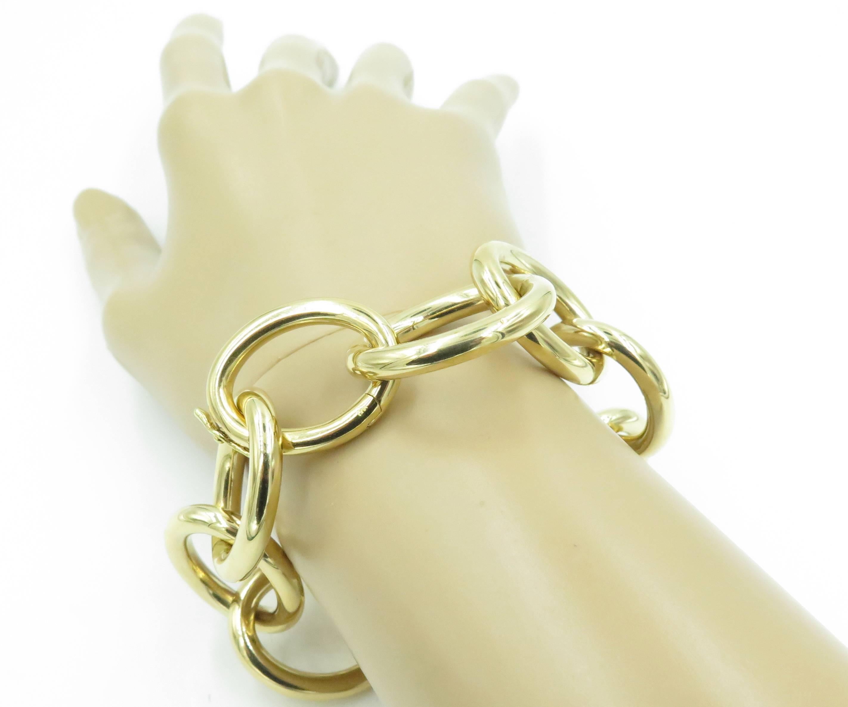 An 18 karat yellow gold open link bracelet.  Signed RFMAS  for Faraone Mennella.  The bracelet is designed as (10) ten interlocking links in a high polish finish.  Signed RFMAS.  Gross weight approximately 54.09 grams. 