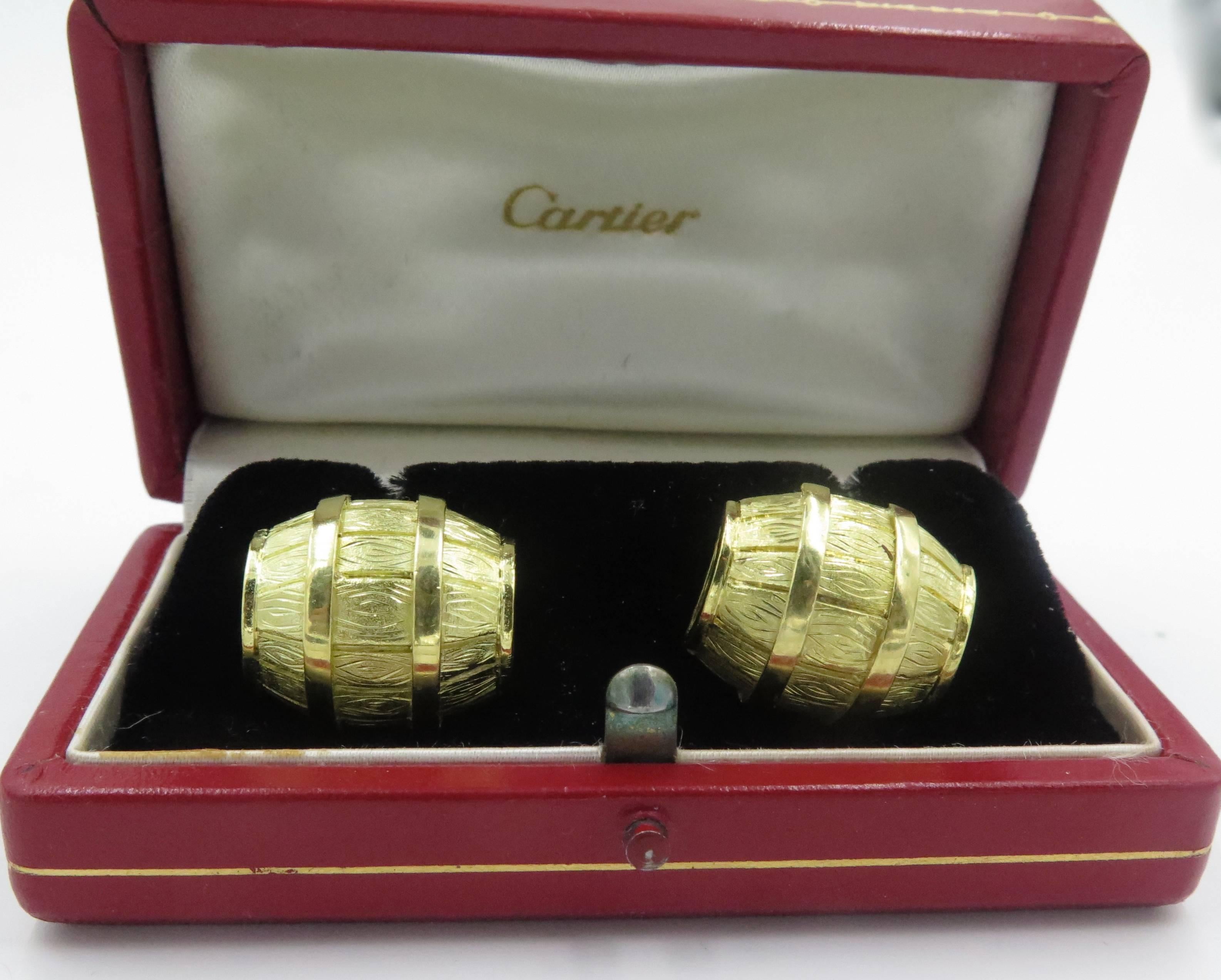 A pair of 18 karat yellow gold cufflinks.  Cartier. Circa 1970.  Signed Cartier 27958.  Each double link designed as a larger and smaller barrel. Accompanied with original box.  Length is approximately 3/4 inches .Gross weight approximately 22.5