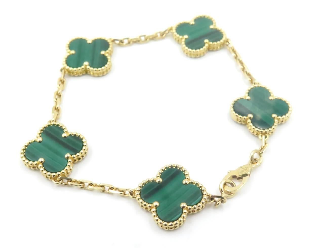 An 18 karat yellow gold and malachite Alhambra bracelet, 5 motifs.  Stamped VCA AU750, numbered JE440243, with makers mark.  Length is 6 1/2 inches.  10.0 grams.