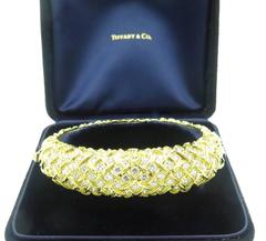 TIFFANY & CO, French Gold and Diamond Bangle Bracelet.