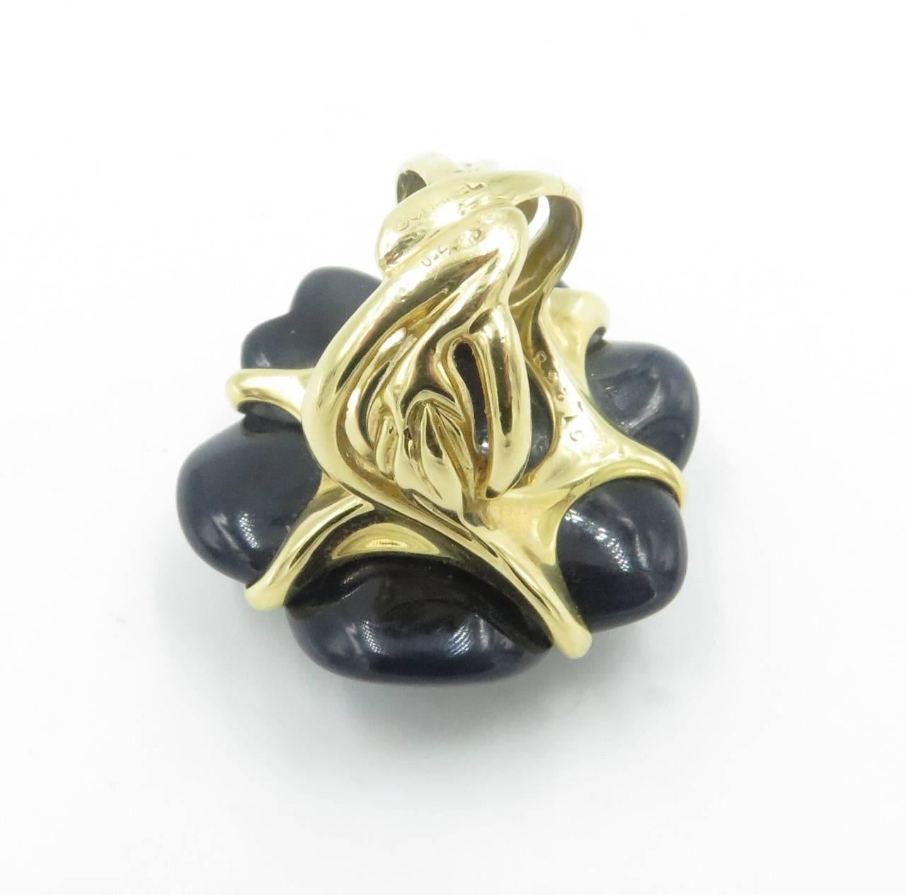 CHANEL Onyx and Gold Camelia Ring. In Excellent Condition In New York, NY