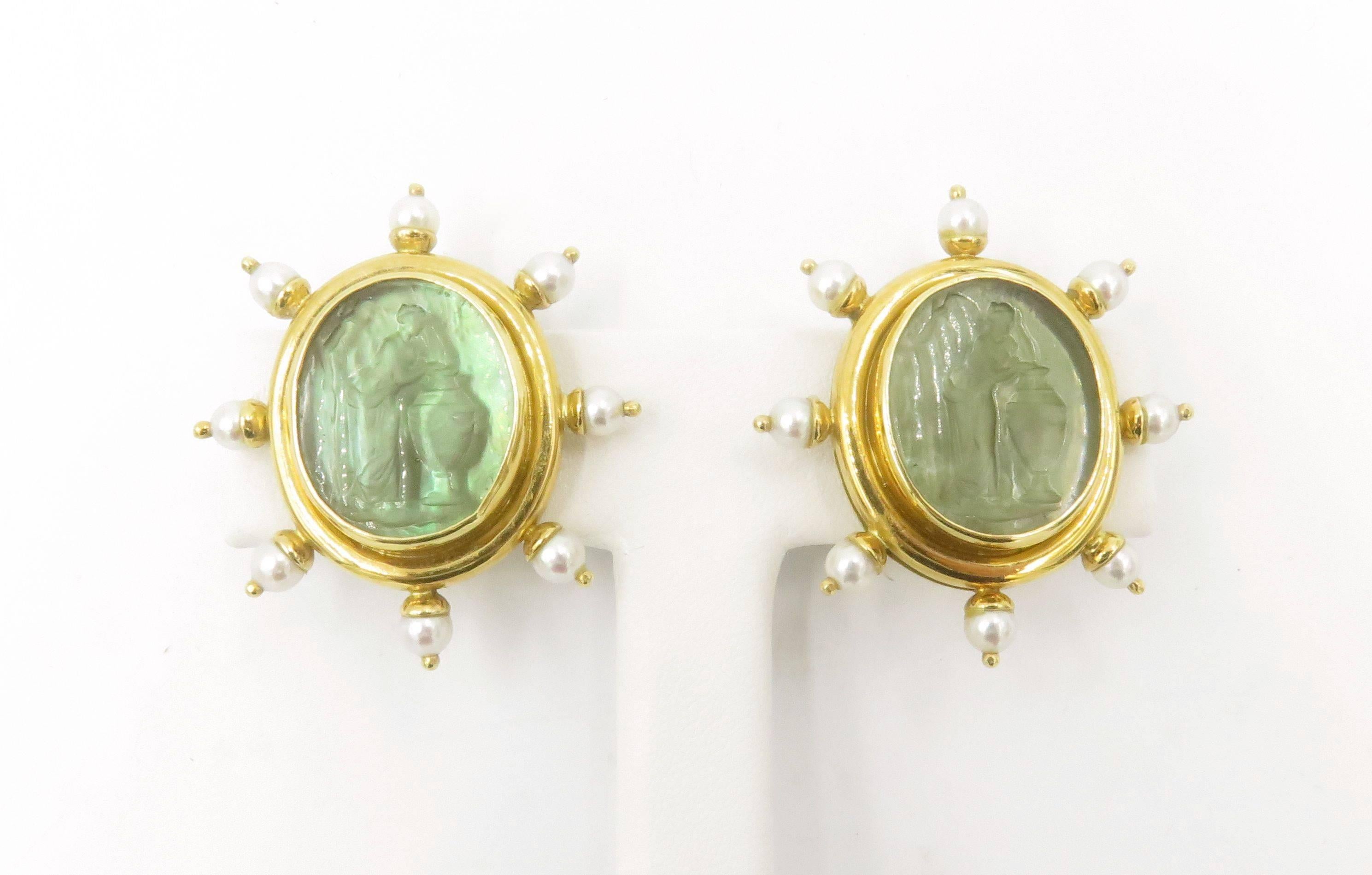 A pair of An 18 karat yellow gold, venetian glass, seed pearl and mother of pearl earrings. Elizabeth Locke. Of oval outline, set with a sage green Venetian glass intaglio, depicting a classical woman, backed by mother of pearl, within a polished