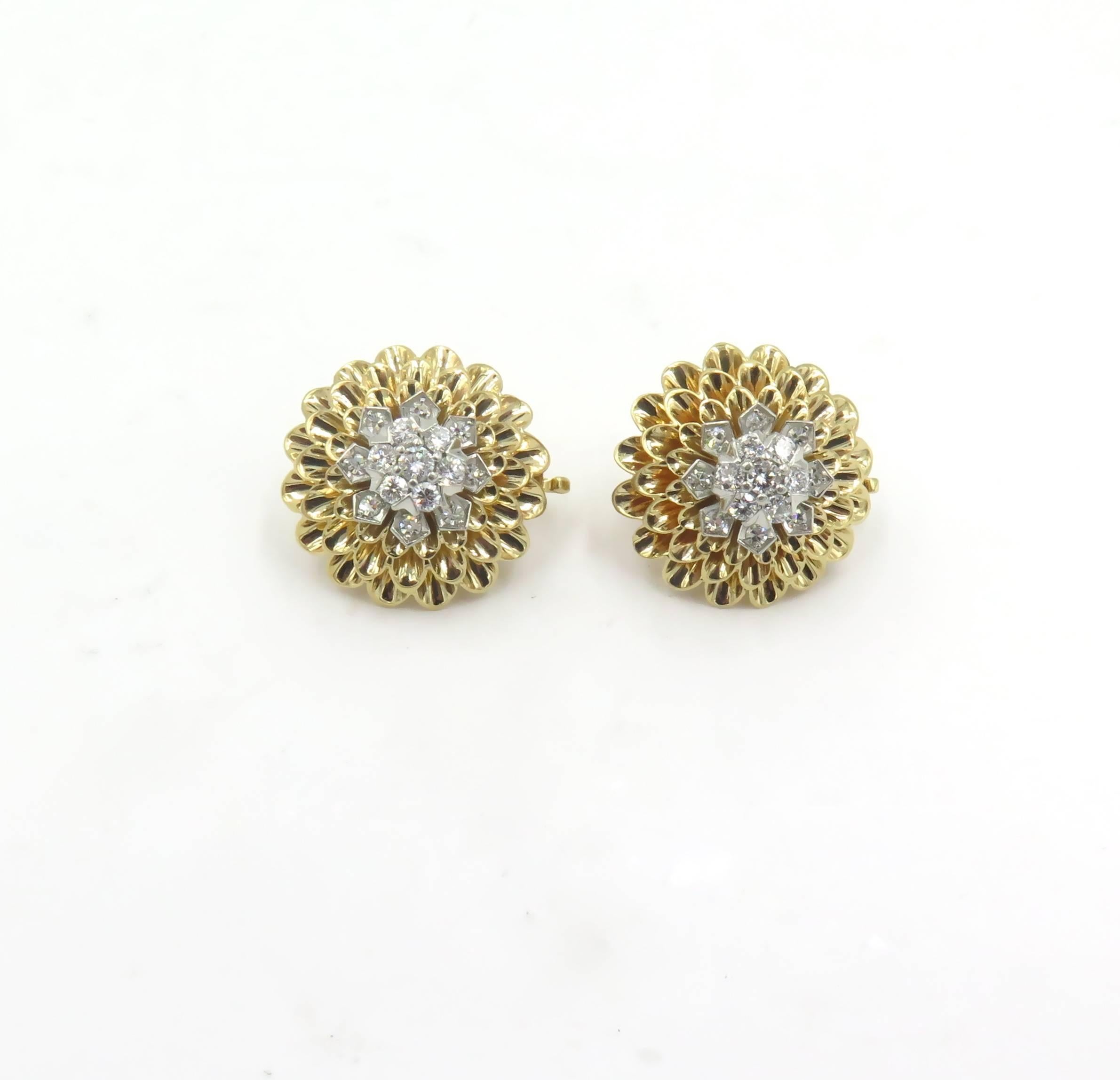 A pair of 14 karat yellow gold and diamond earrings.  Tiffany & Co.  Circa 1950. Each designed as polished gold chrysanthemum, centering a cluster of circular cut diamonds. Thirty (30) diamonds weigh approximately 1.10 carats.  Diameter is