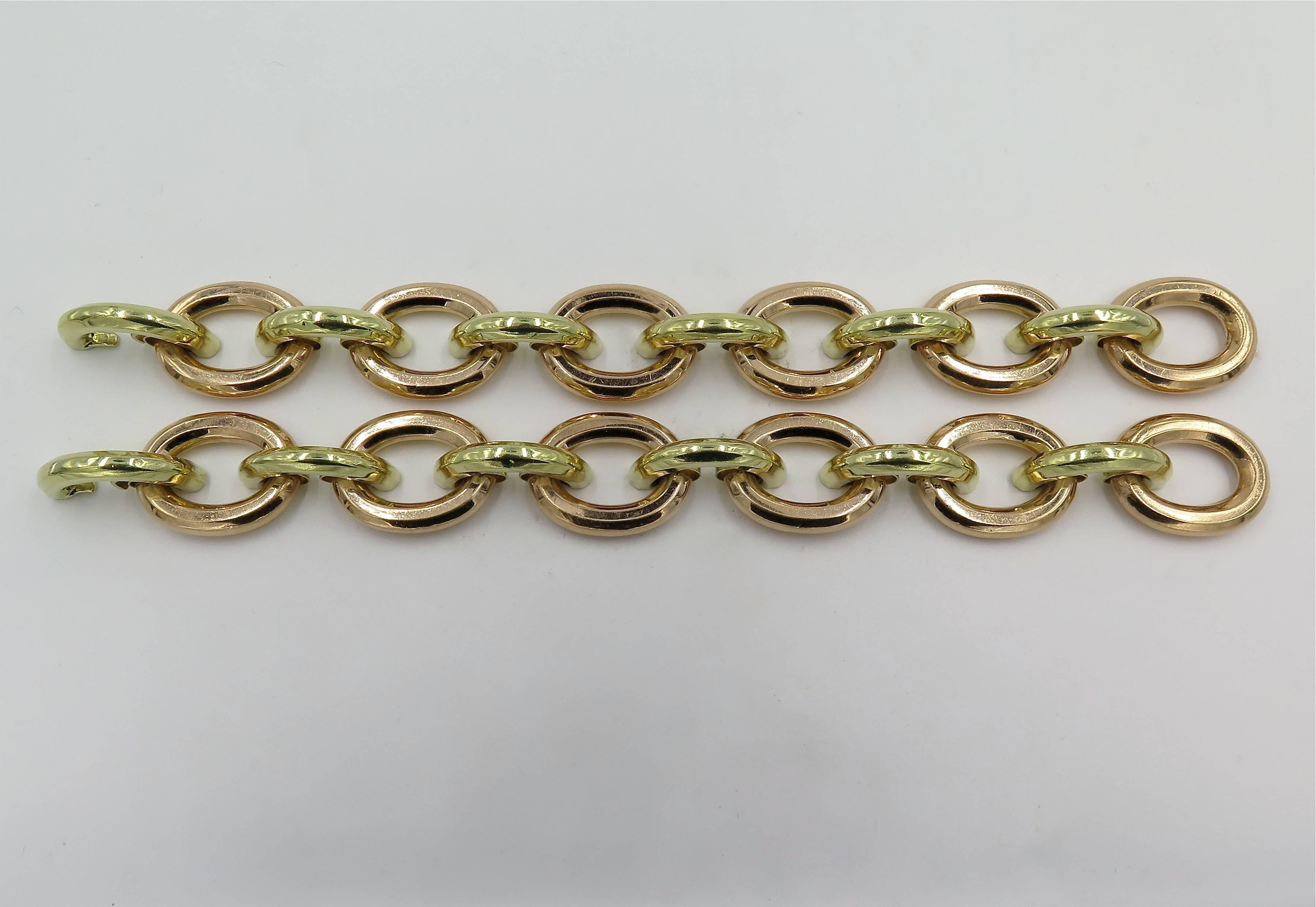 A pair of 14 karat rose and yellow gold bracelets. 1940. Each designed as a line of oval rose gold links, alternating with yellow gold curb link spacers. Length of each is approximately 7 1/4 inches. Gross weight is approximately 59.6 grams. 