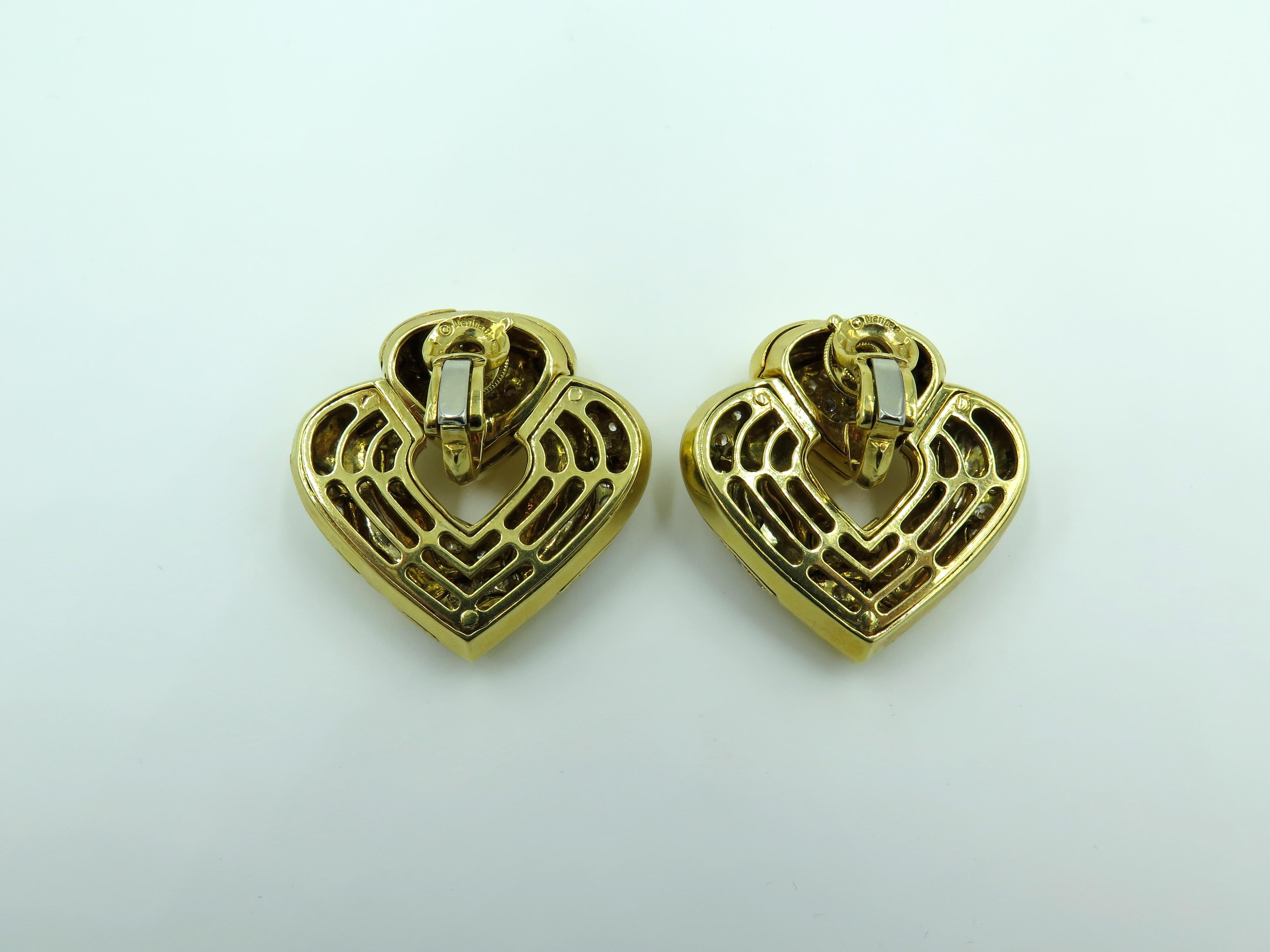 A pair of 18 karat yellow gold and diamond Pardy earrings. Marina B. Circa 1980. Of polished heart shaped door knocker design, enhanced by pave set diamonds. One hundred and fifteen diamonds weigh approximately 3.45 carats. Length is approximately 1