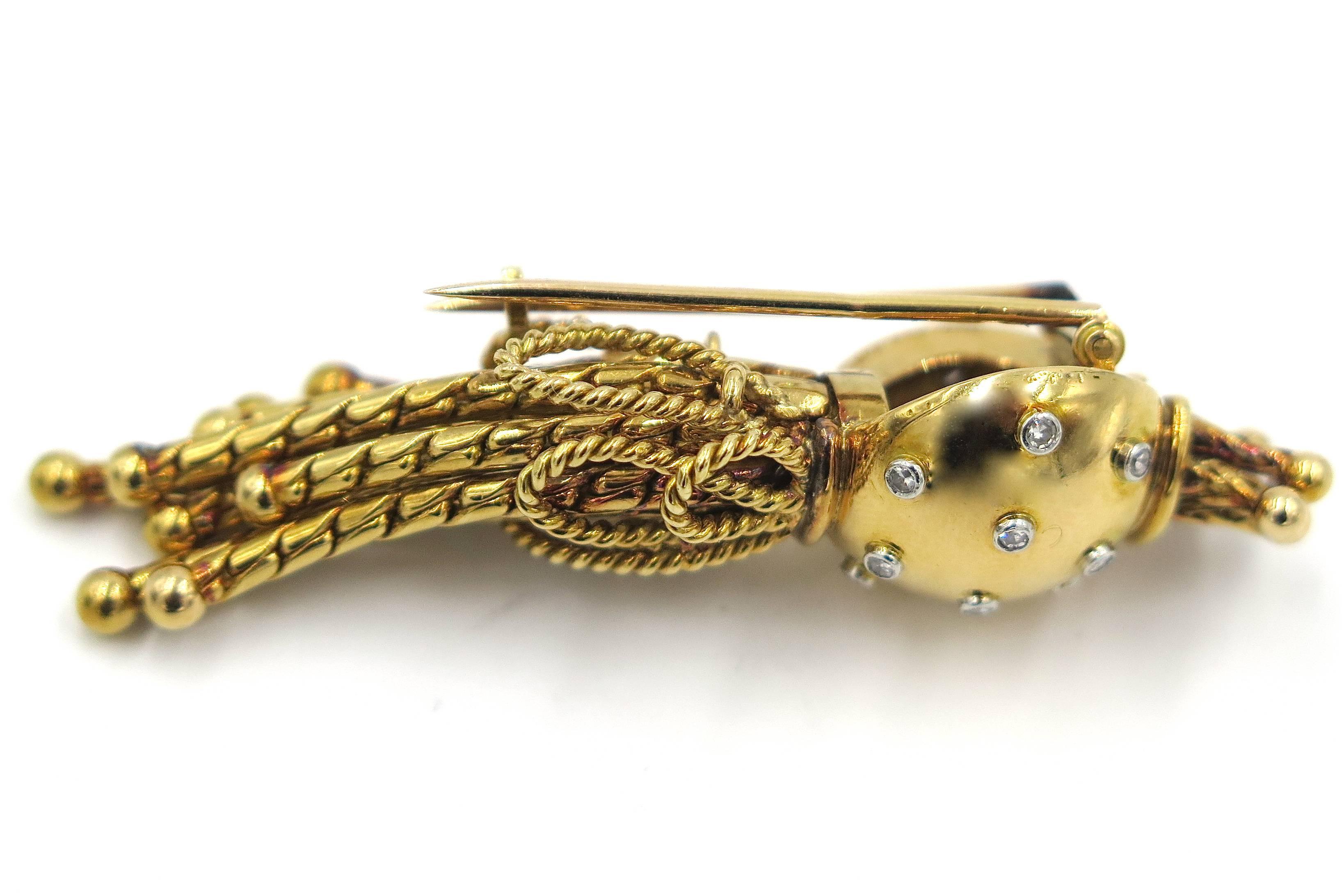 A French 18 karat yellow gold and diamond brooch, Marchak, Paris, Circa 1940s.  Signed Marchak Paris 23740 and hallmarked with French maker’s mark of RD and gold marks.  The brooch is designed with a polished dome at the top set with 16 collet set