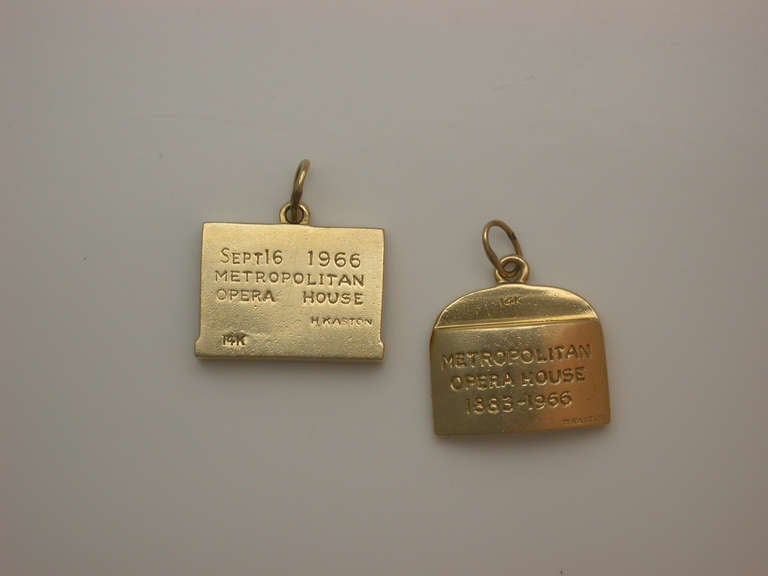 Tiny bits of New York City history for the arts enthusiast, two charms in 14kt yellow gold, the first depicting the facade of Lincoln Center, rectangular on flexible bail, inscribed on the back 