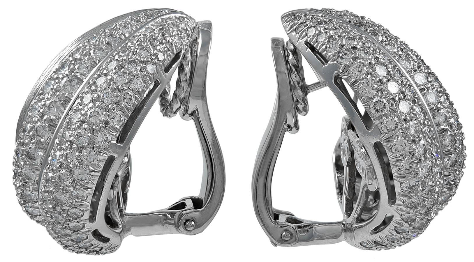 An elegant pair of brushed Sabi-finish earclips, designed as puffed scrolls with nice dimension on the ear, approximately 4 carats total weight gem diamonds set in platinum, signed Dunay for Henry Dunay, numbered C6875, stamped PT950, measuring