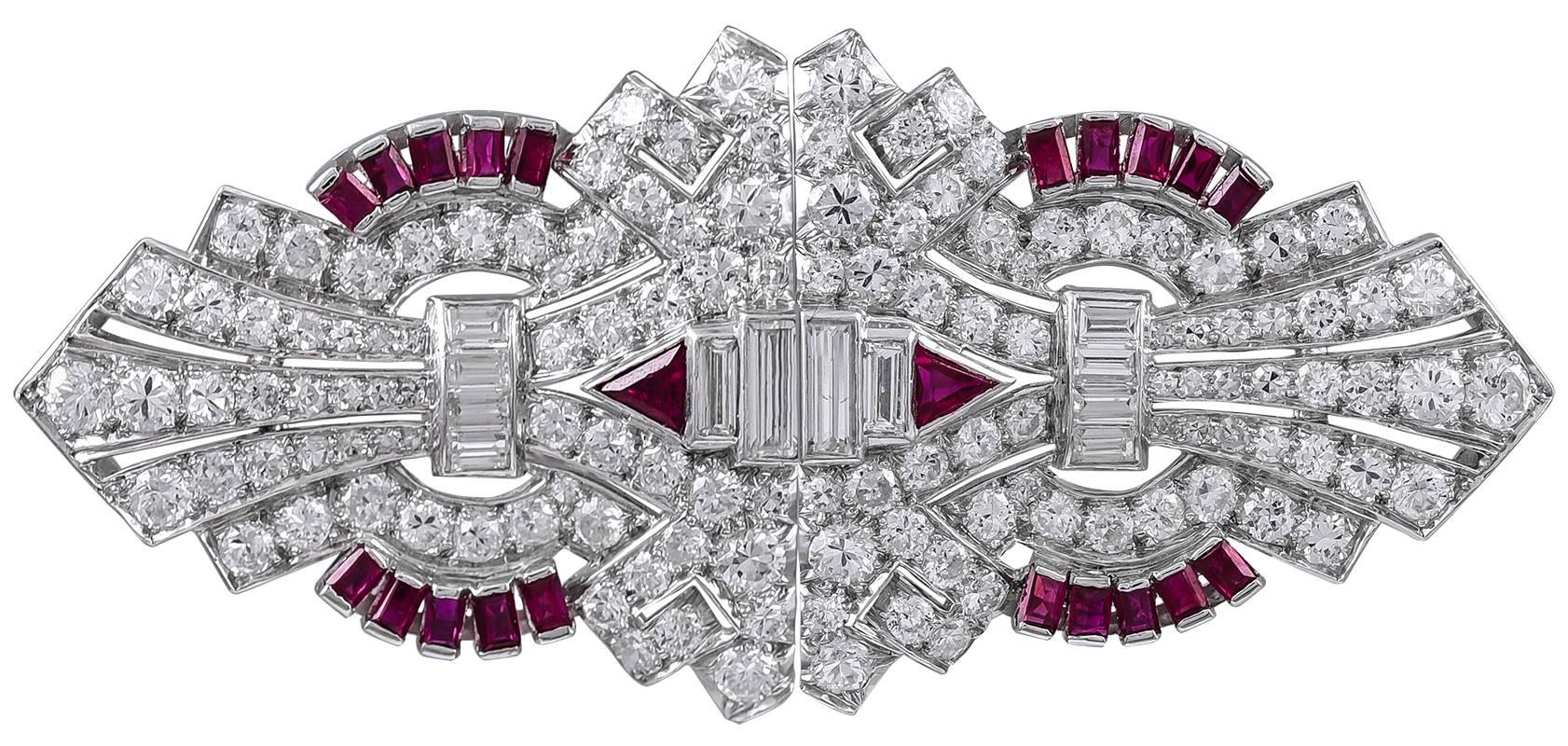 Of classic geometric Art Deco design, the ruby (approximately 1 carat) and diamond (approximately 4 carats) dress clips mounted in platinum, featuring triangular, baguette and circular-cut stones, measuring approximately 1 1/4 inches long each or 2