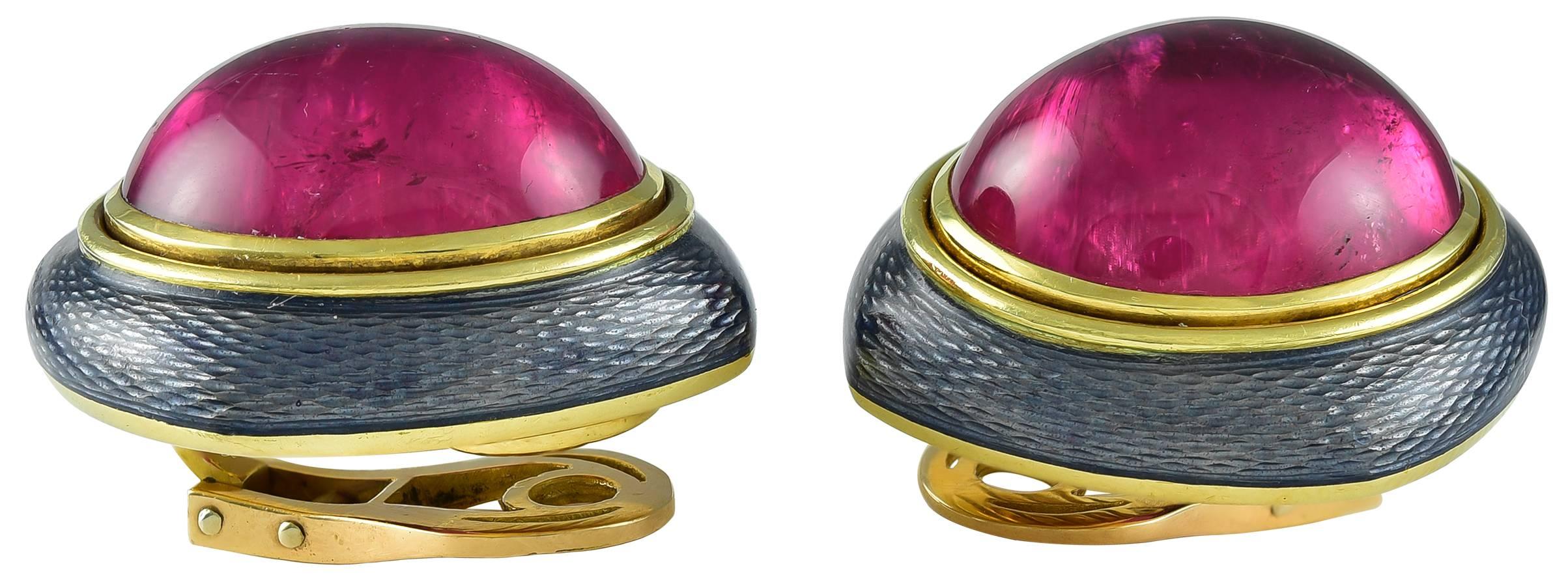 Impressive tourmaline earclips featuring two spectacular candy pink oval cabochons weighing 49.83 carats, within handsome textured grey enamel frames, all mounted in polished 18kt gold, signed DeVroomen for Leo DeVroomen, with full English marks