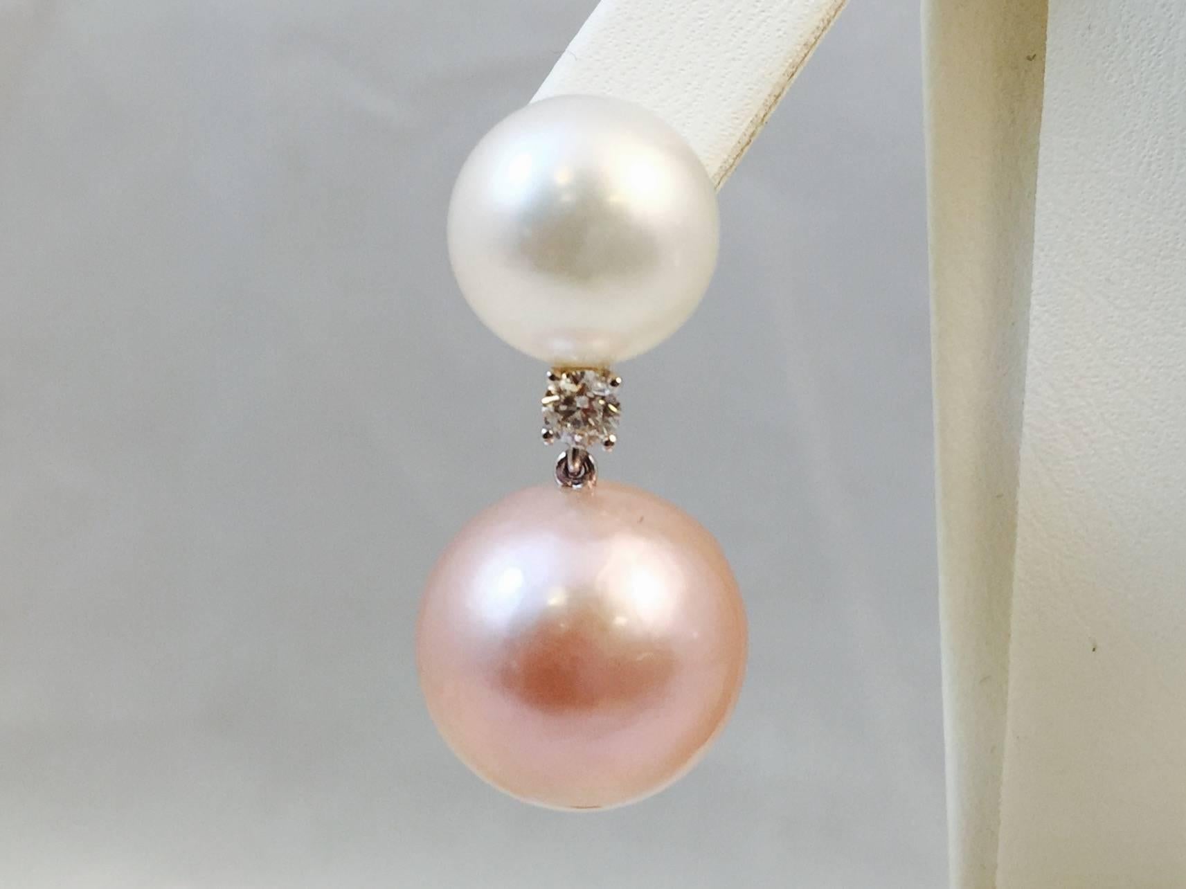 A playful twist on a classic earring!  Based on 18 karat white gold these fantastic earrings alternate white cultured South Sea and natural pink cultured Freshwater pearls.  Top pearls measure 11MM while bottom pearls are an important 14MM. Bottom