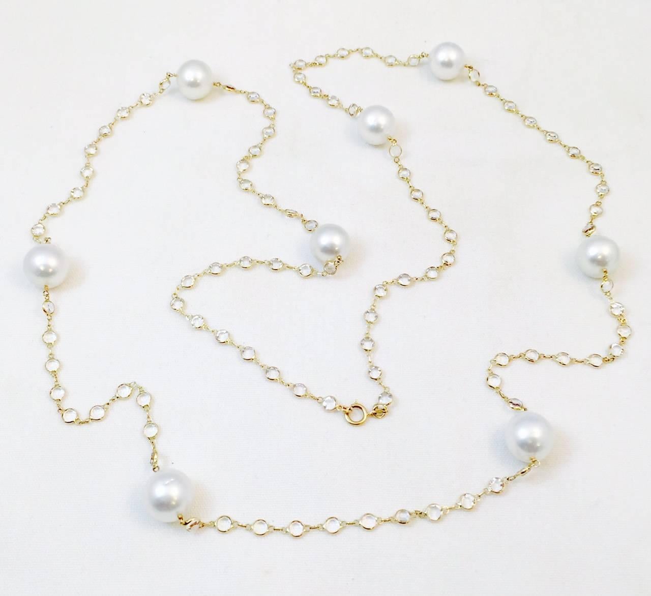 This is the necklace you want!  Thirty-seven inches of WOW!  Eight beautifully matched white cultured South Sea Pearls are the focal point.  Generous 12-13MM each.   The entire 14 karat yellow gold chain contains bezel set, faceted white topaz. 