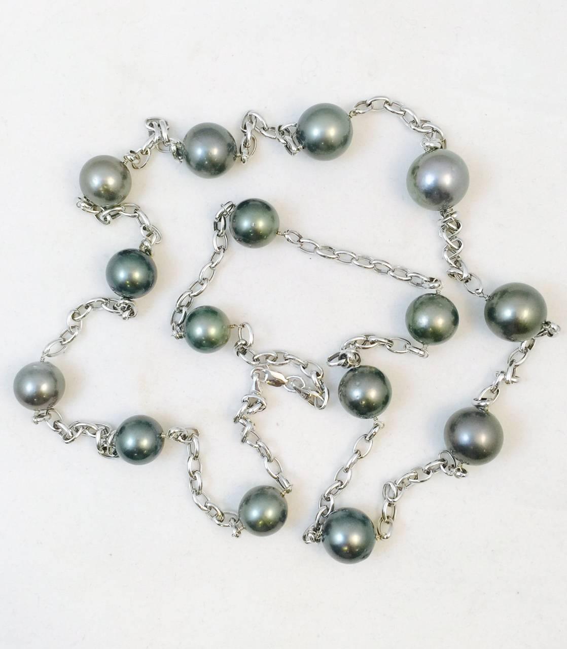A glorious addition to any fine jewelry lovers collection.  Pearls are such a wonderful staple!  This fantastic necklace boasts fifteen cultured South Sea black pearls measuring an impressive 12-15MM each. The 14K white gold 38