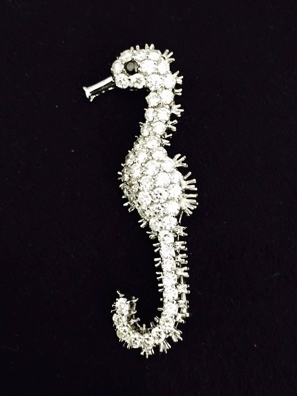 If you have an affinity for all sea creatures, this amazing 18 karat white gold Sea Horse is a must!  Attention to detail is fantastic!  Heavily encrusted with an important total weight of 4.50 carats having F color, VS1 clarity, accented with a