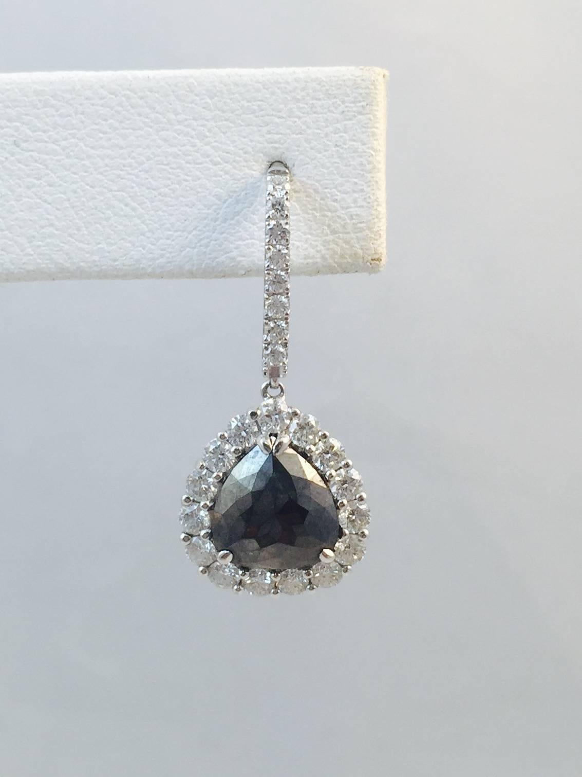 18 karat white gold is the platform for these stunning earrings.  Designed by Karina Brez, who uses very unusual stones in her creations, these Black Diamonds weigh 1.81 ct tw.  Continental backs are fronted with prong set brilliant cut White