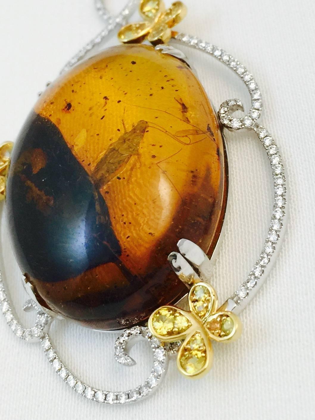 A 20 million year old, one of a kind piece of Amber found in the Dominican Republic, is the centerpiece of this statement pendant.  The design acumen of Karen Brez explodes in this piece which is part of her Garden Collection.  An ancient stone