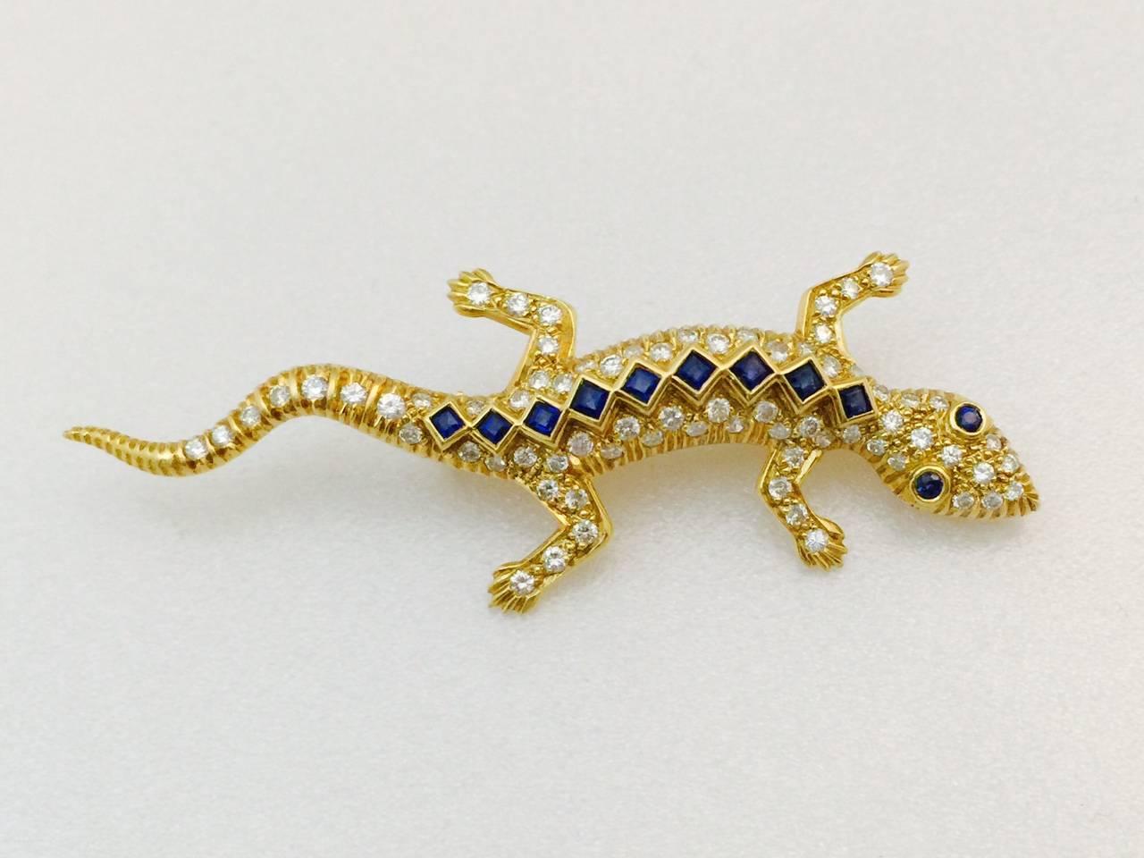 In ancient Egypt and Greek symbolism the lizard represented divine wisdom and good fortune. How fortunate that this fabulous lizard booch is now available!  Life like detail in 18K yellow gold features bezel set, perfectly matched, princess cut