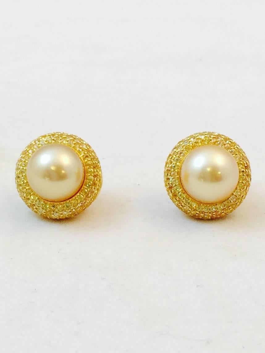 Pearls are a staple of every ladies fine jewelry collection.  These magnificent 18K golden pearl and yellow sapphire button earrings would be an amazing addition to any of those collections.  Masterfully crafted in Europe using 18K yellow gold, they