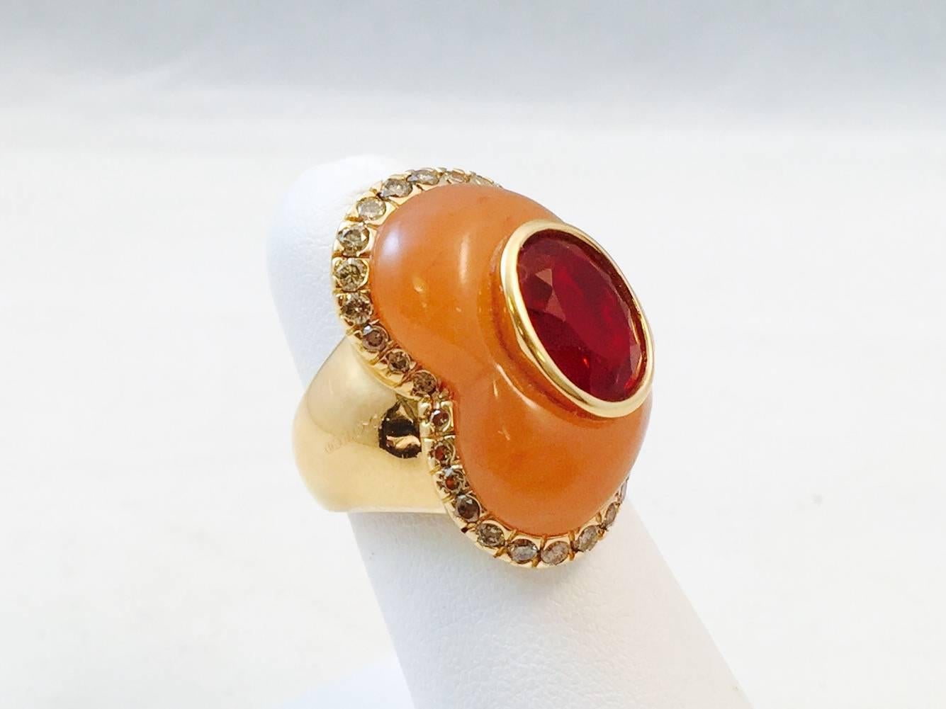 Old world jewelry craftsmanship coupled with innovative design is the hallmark of Oro Trend jewelry.  Masterfully crafted in Valenza, Italy, where 100% of their products originate.  A sculptural, offset heart shape depicted in carved peach agate is