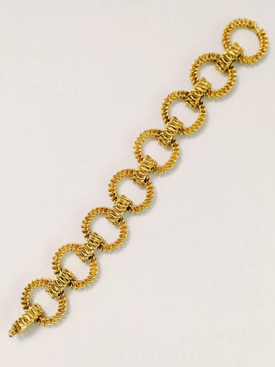 For Tiffany lovers worldwide!  A timeless, "wear daily" bracelet, meticulously crafted in 18 karat yellow gold.  Curved, open chain link circles are separated by matching narrow links in between each circle. Clasp with figure eight safety