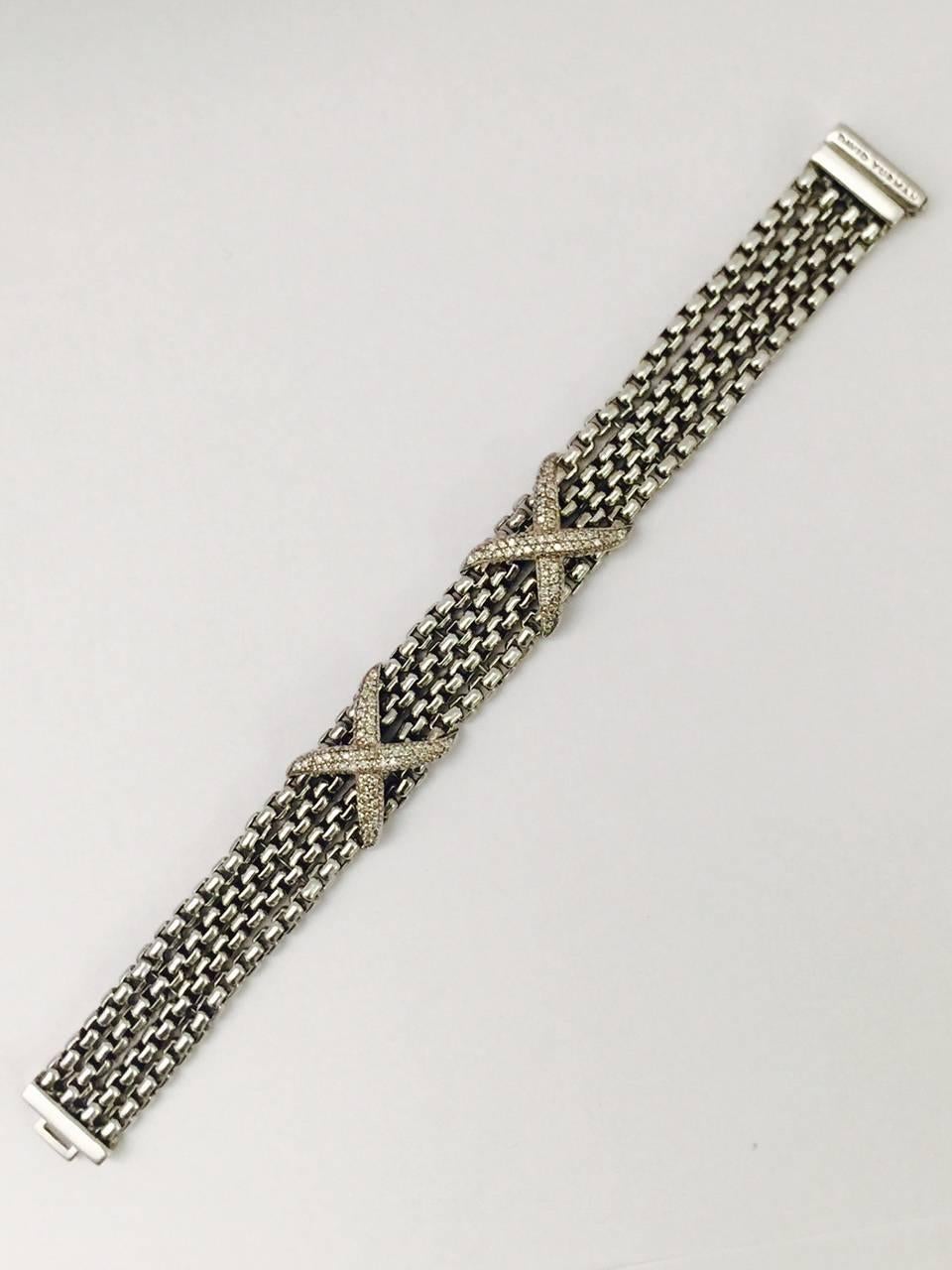 David Yurman was the first major designer to set diamonds in Sterling Silver, revolutionizing the world of Fine Jewelry!  This stunning four row box chain bracelet is adorned with two diamond pave X's.  Kiss!  Kiss!  Approximate total weight of